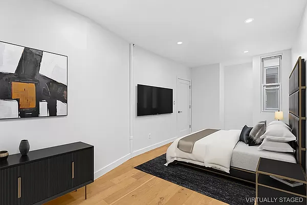 82 Clinton Avenue, Unit 4 Brooklyn, NY 11205 - Photo 6 of 11 a bedroom with a bed and a flat screen tv