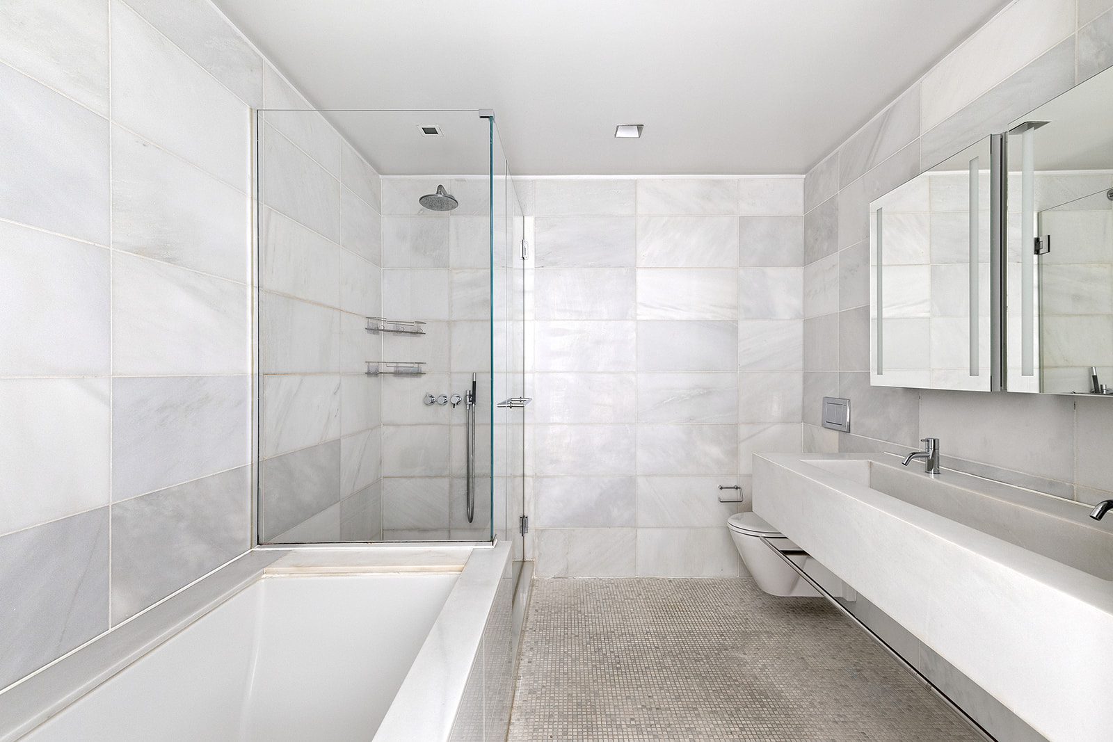 400 East 67th Street, Unit 12D Manhattan, NY 10065 - Photo 4 of 9 a spacious bathroom with a bathtub and a sink