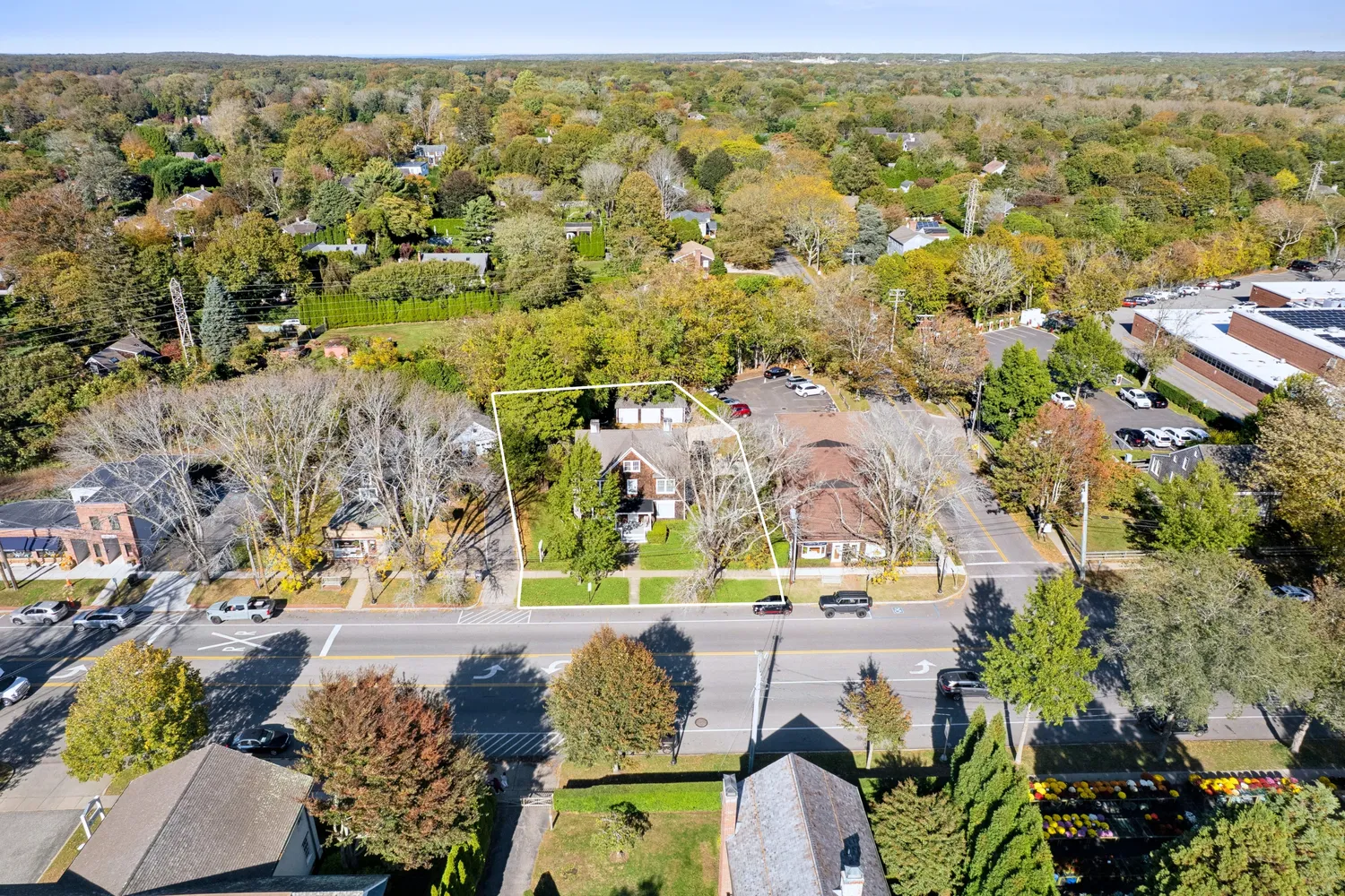 an aerial view of residential houses with outdoor space