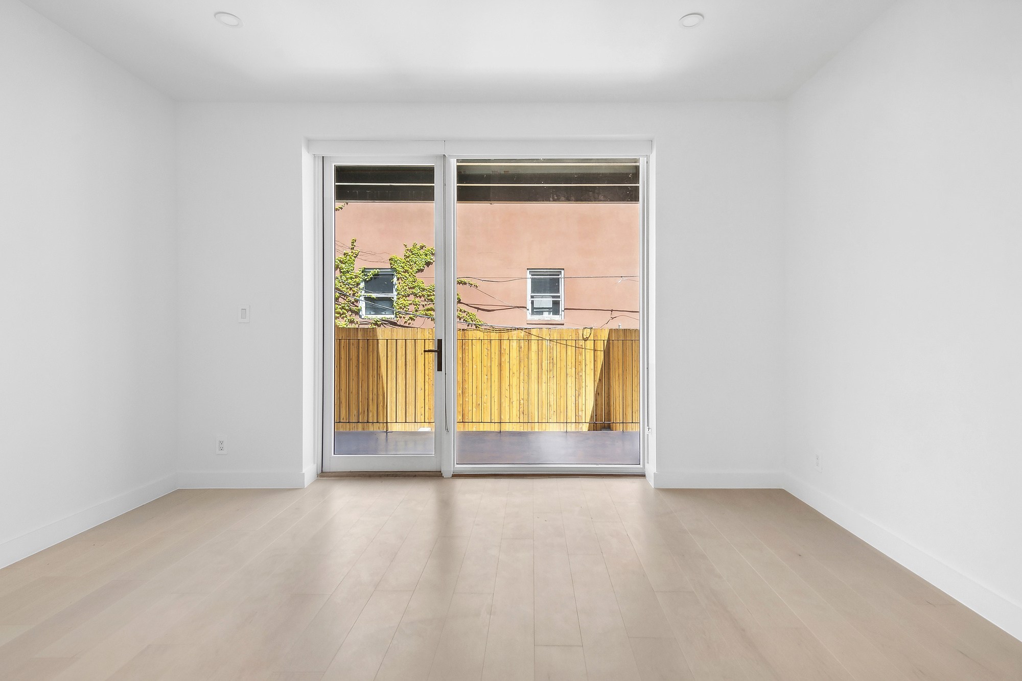 473 Union Street, Unit 1 Brooklyn, NY 11231 - Photo 4 of 15 an empty room with a floor to ceiling window and floor to ceiling window