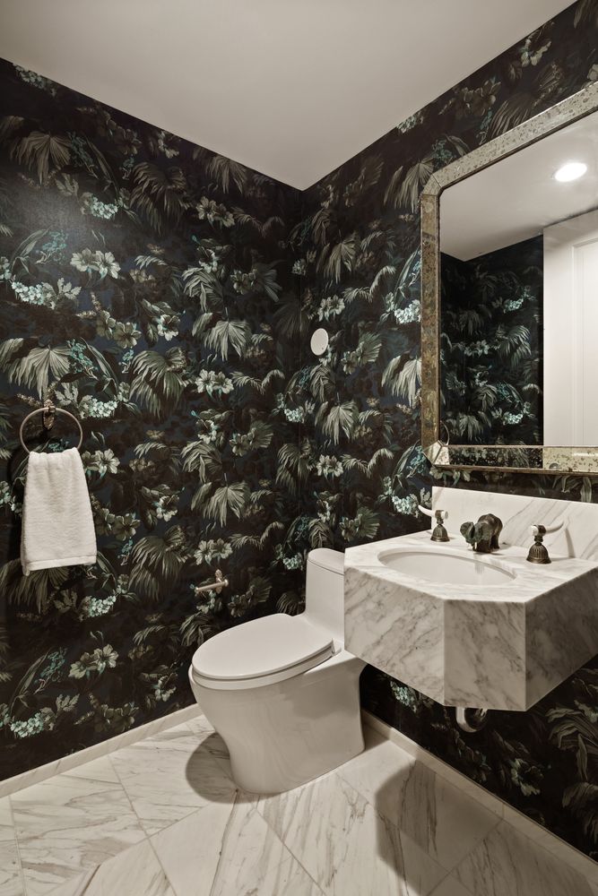 a bathroom with a sink toilet and mirror