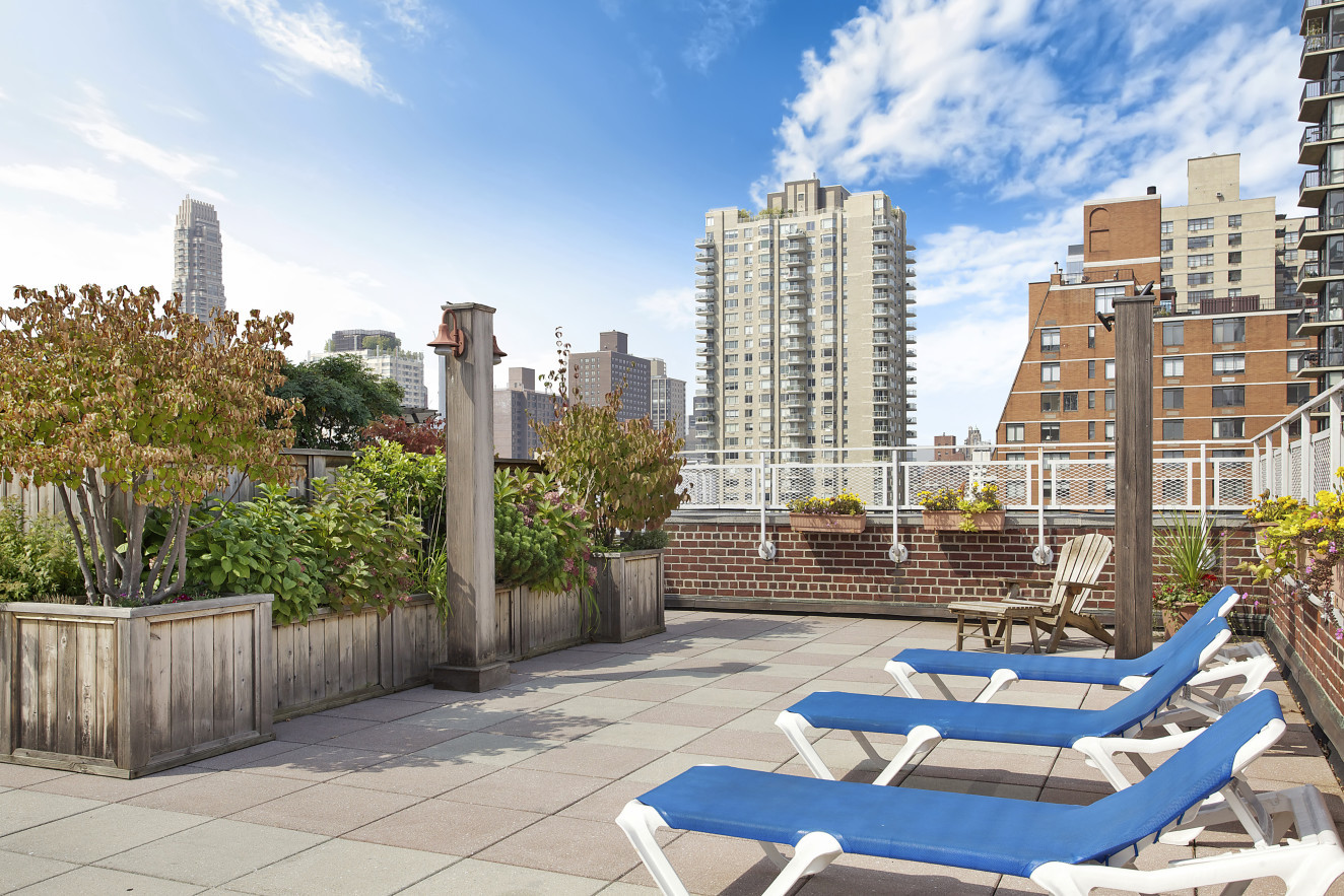 401 East 74th Street, Unit 1A Manhattan, NY 10021 - Photo 10 of 14 a view of a city with tall buildings