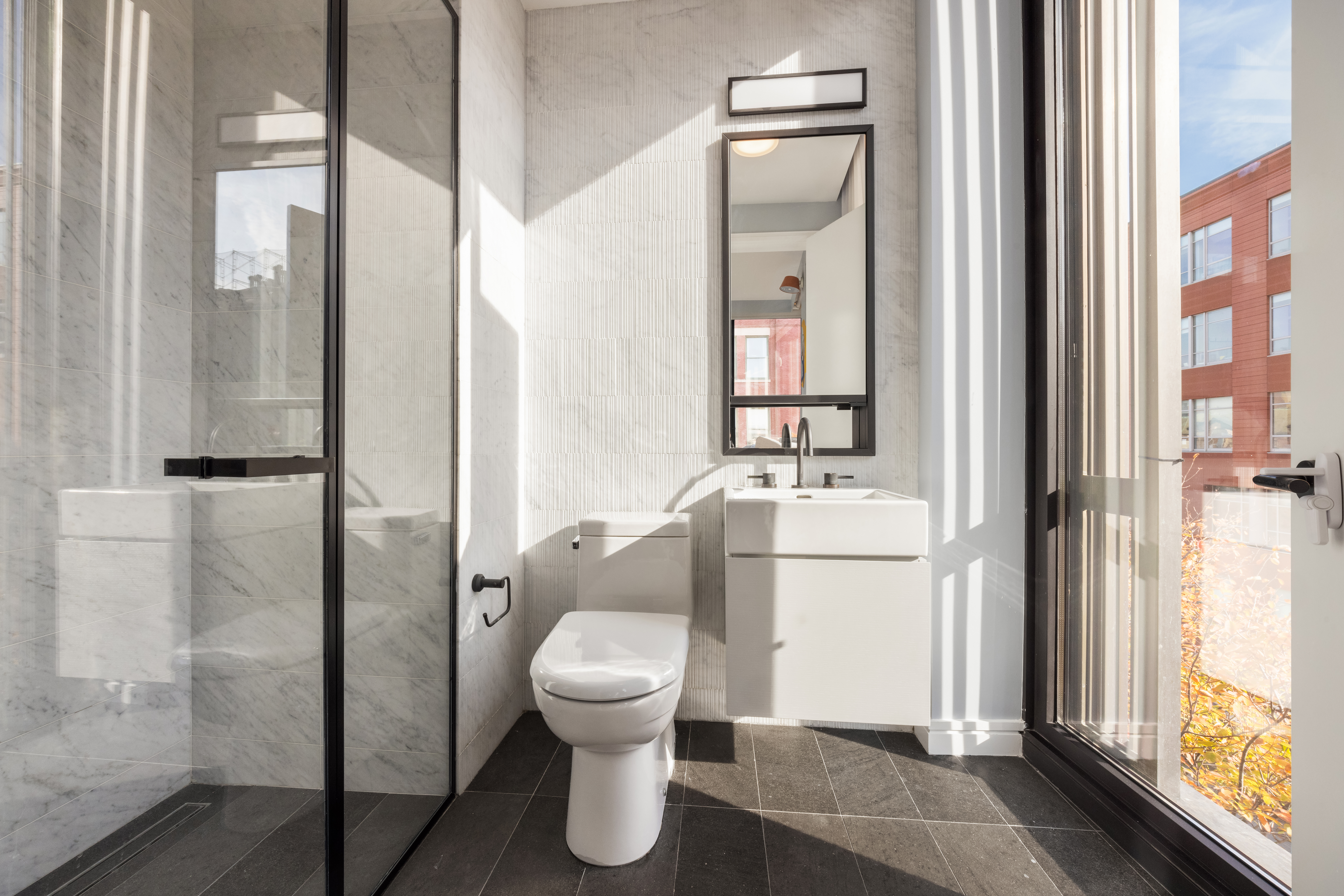 100 Barrow Street, Unit 7/8A Manhattan, NY 10014 - Photo 20 of 23 a bathroom with a toilet and a sink