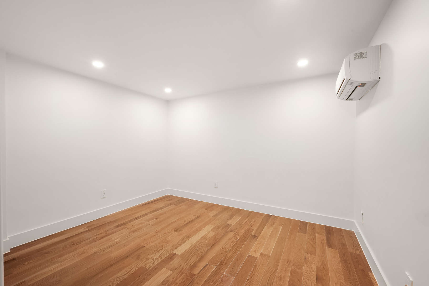 61 West 70th Street, Unit 1A Manhattan, NY 10023 - Photo 11 of 15 a view of room with wooden floor and fan