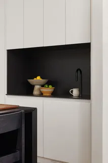 a kitchen with a sink and cabinets