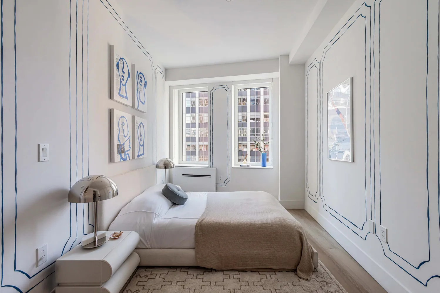 a bedroom with a bed and glass windows