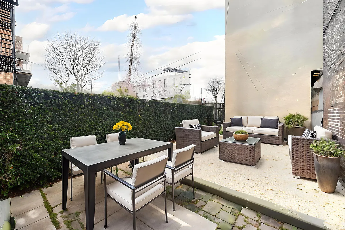 a view of a terrace with furniture