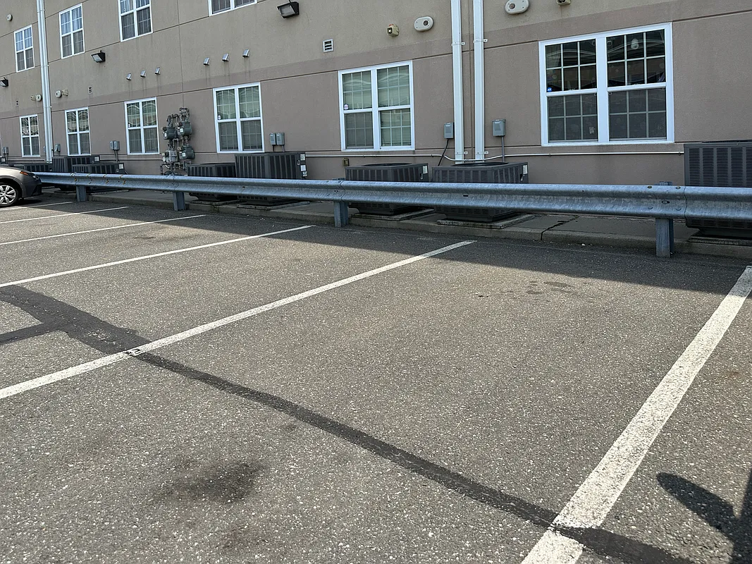 10220 Rockaway Beach Boulevard, Unit 1A Queens, NY 11694 - Photo 7 of 8 a swimming pool with outdoor seating and yard