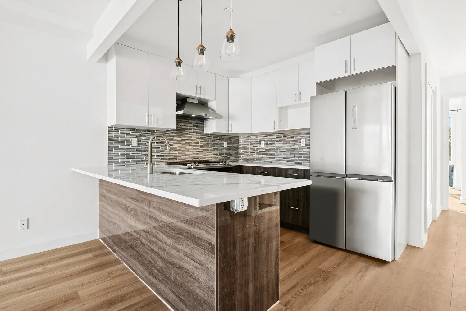 a kitchen with stainless steel appliances granite countertop a sink and a refrigerator