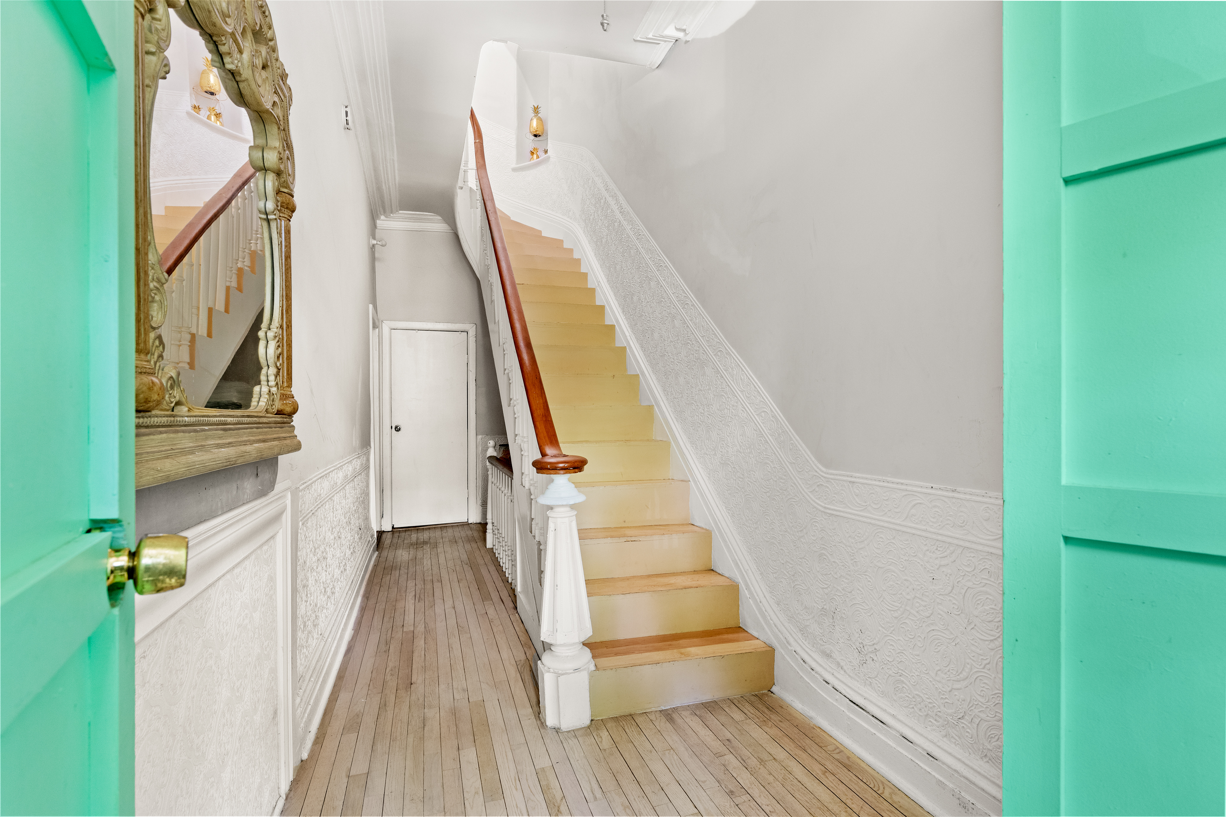 300 Gates Avenue Brooklyn, NY 11216 - Photo 3 of 13 a view of staircase with white walls and railing