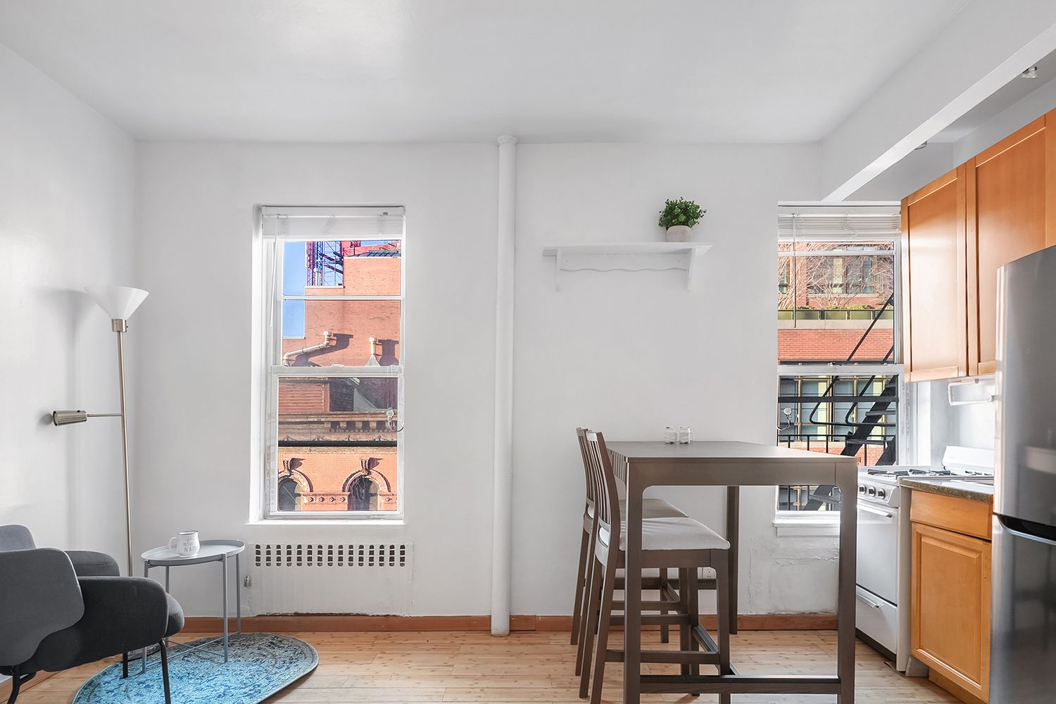 304 West 10th Street, Unit 4B Manhattan, NY 10014 - Photo 6 of 10 a view of a workspace with furniture and a window