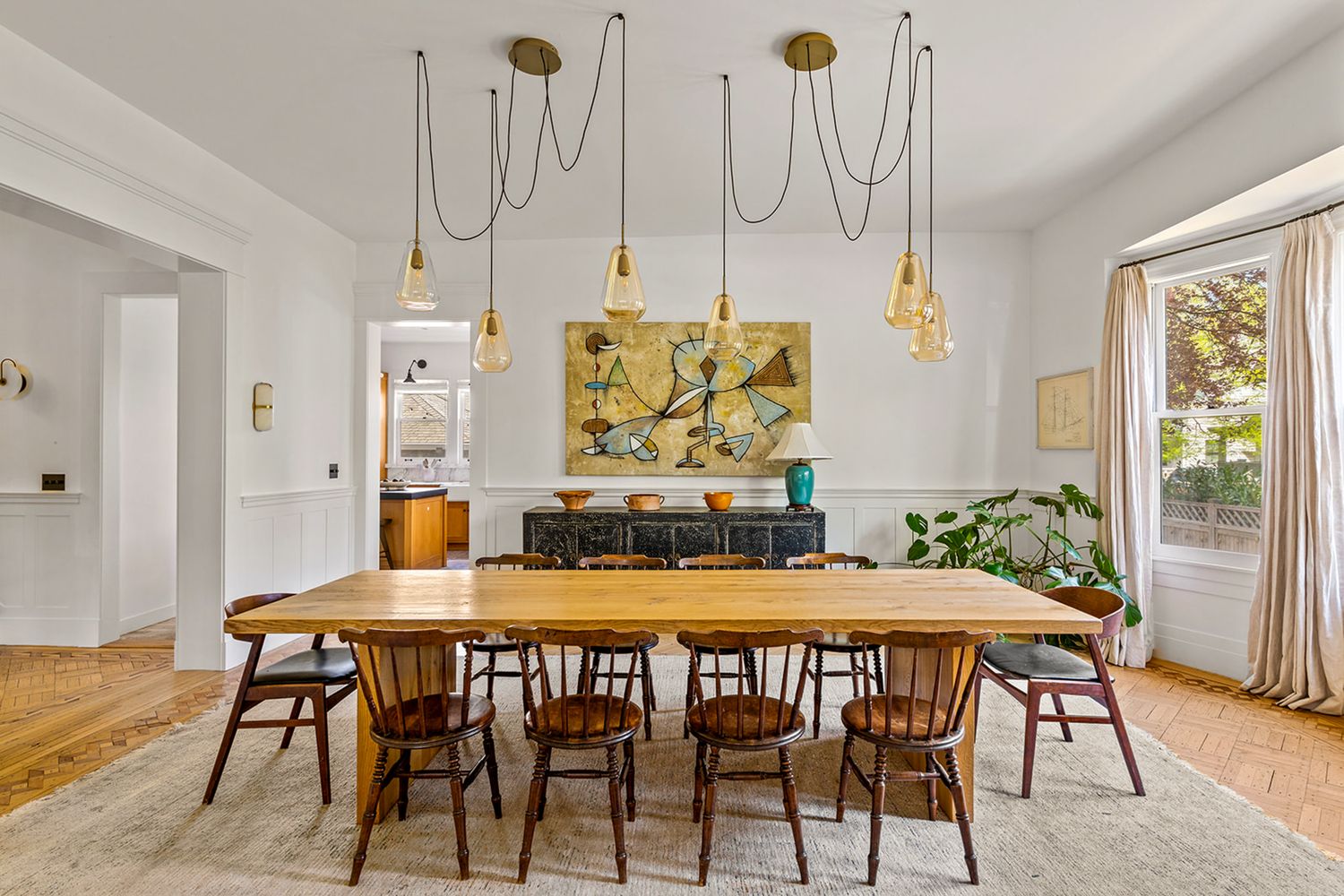 a view of a dining room with furniture window and wooden floor