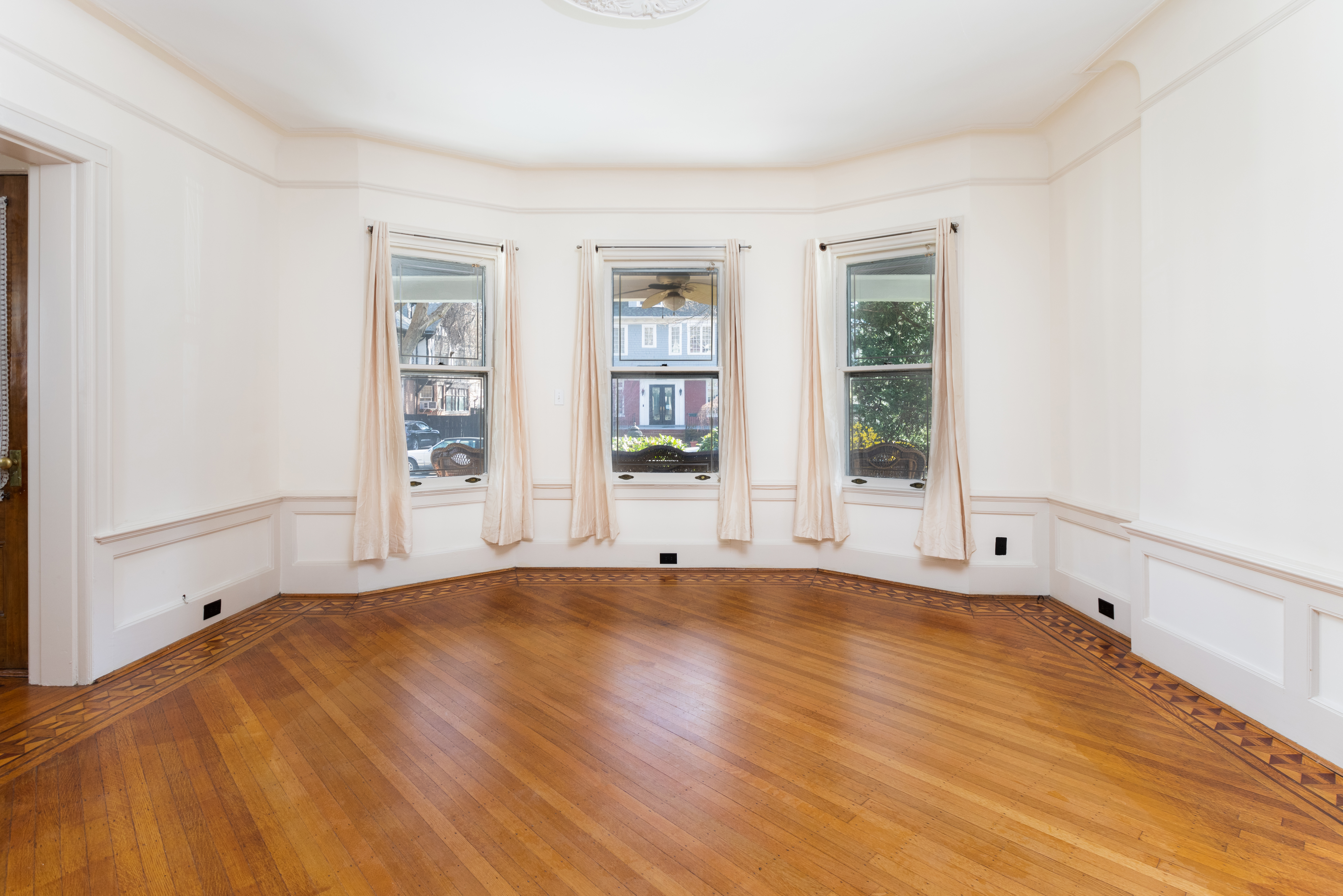 196 Marlborough Road Brooklyn, NY 11226 - Photo 10 of 23 a view of an empty room with wooden floor and a window