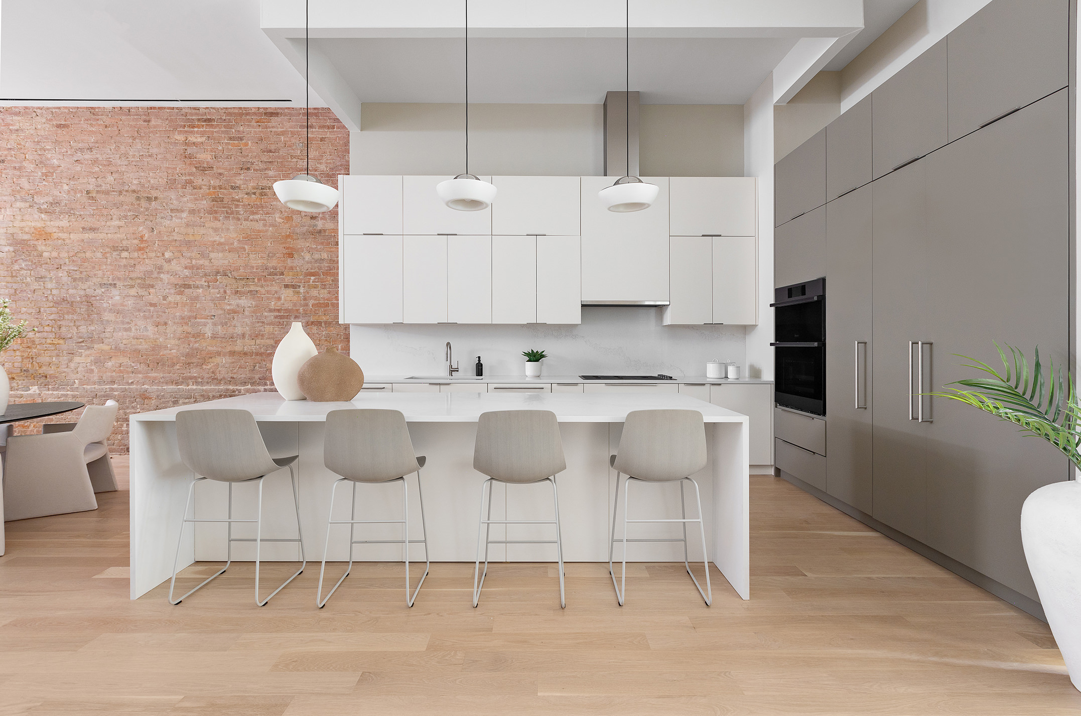 66 Reade Street, Unit TH Manhattan, NY 10007 - Photo 3 of 18 a kitchen with cabinets and chairs