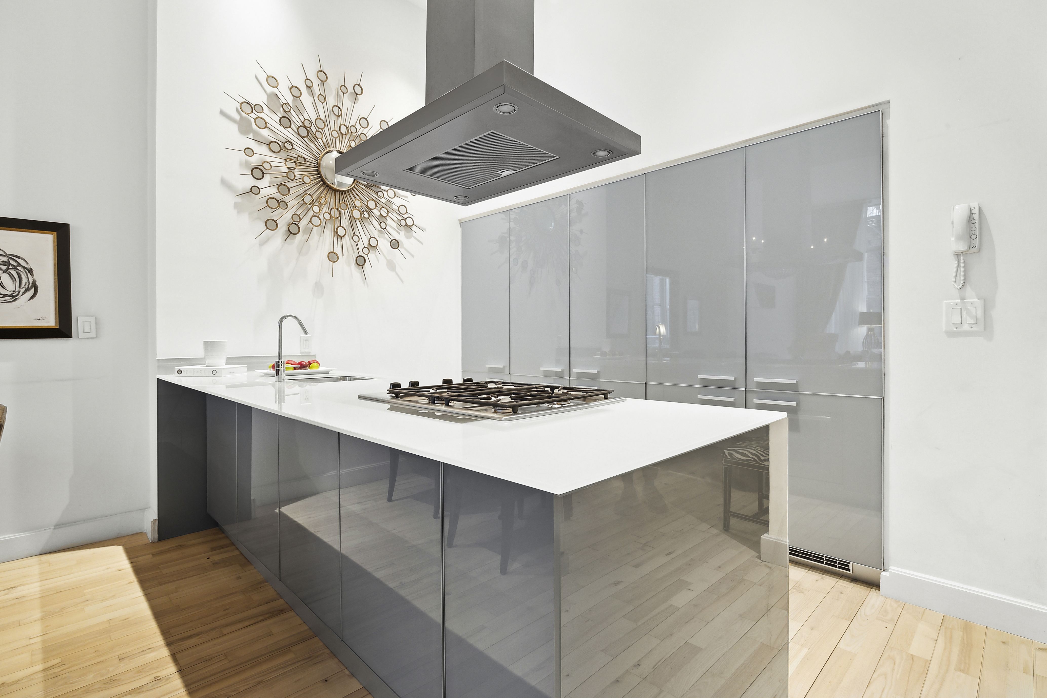 420 West 25th Street, Unit TH1E Manhattan, NY 10001 - Photo 7 of 22 a kitchen that has a sink and a stove