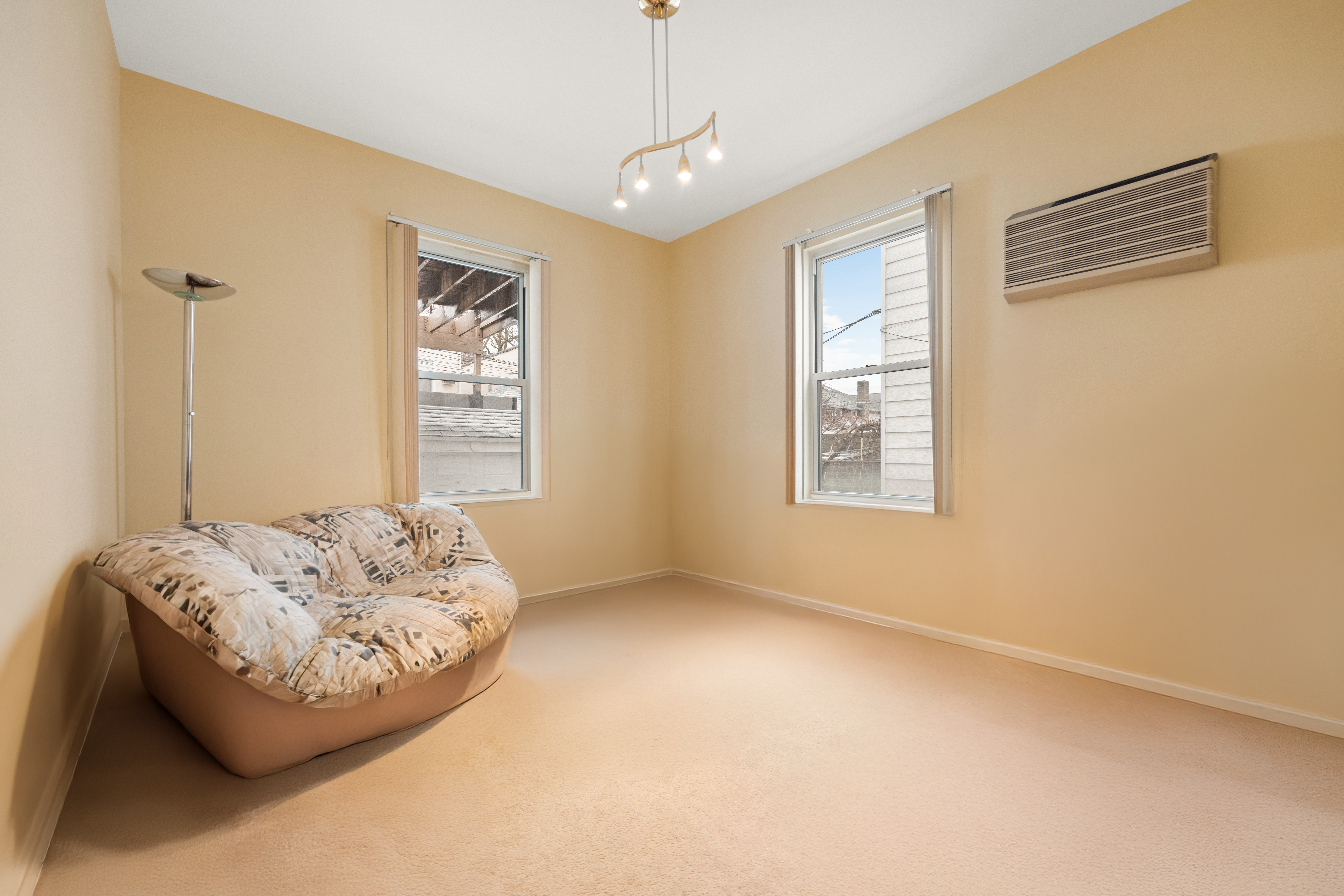 1635 West 12th Street Brooklyn, NY 11223 - Photo 13 of 21 a bedroom with bed and window