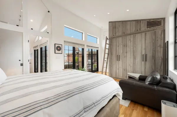 a bed room with a bed and a couch