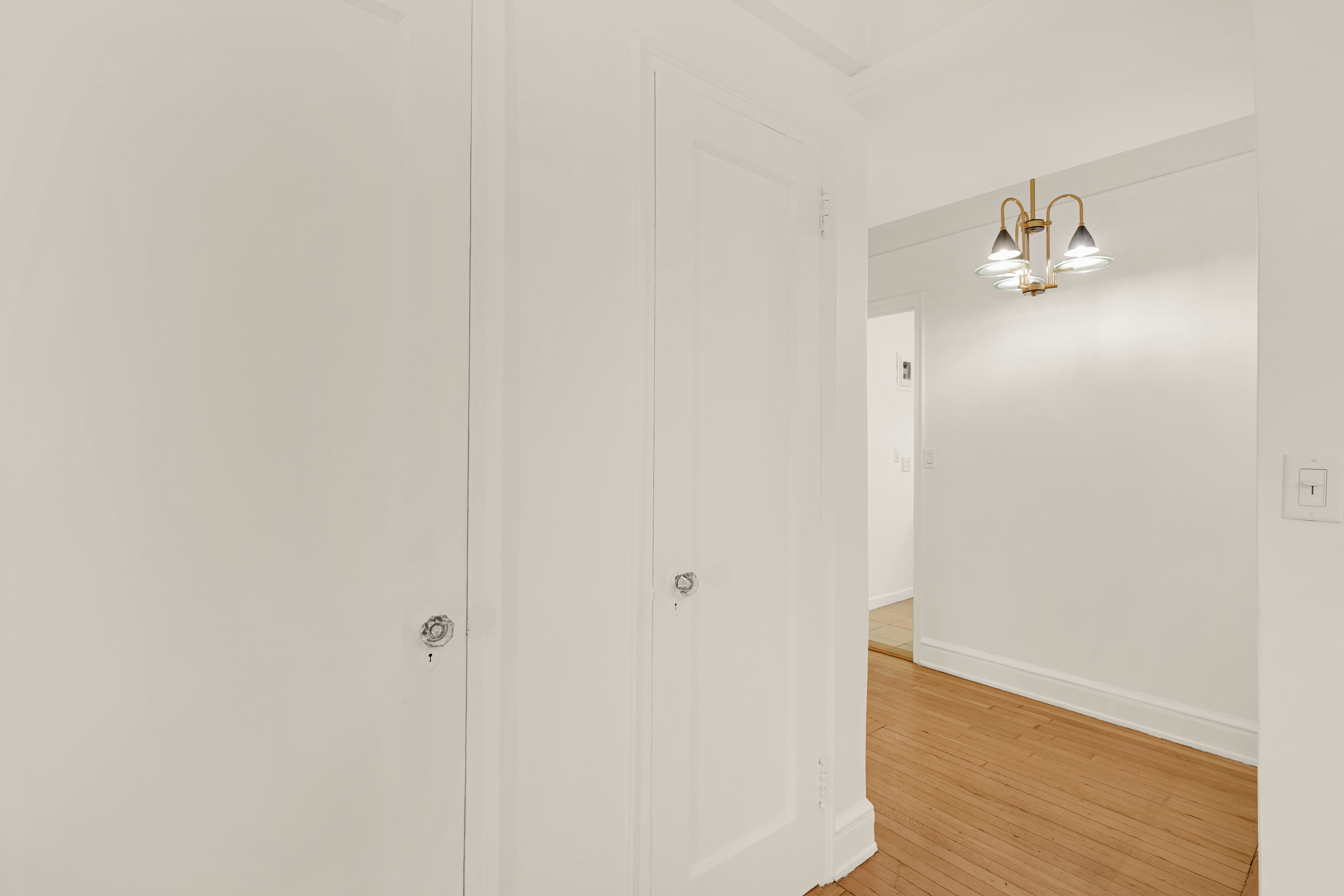 74 West 68th Street, Unit 5A Manhattan, NY 10023 - Photo 18 of 25 a view of a hallway with wooden floor