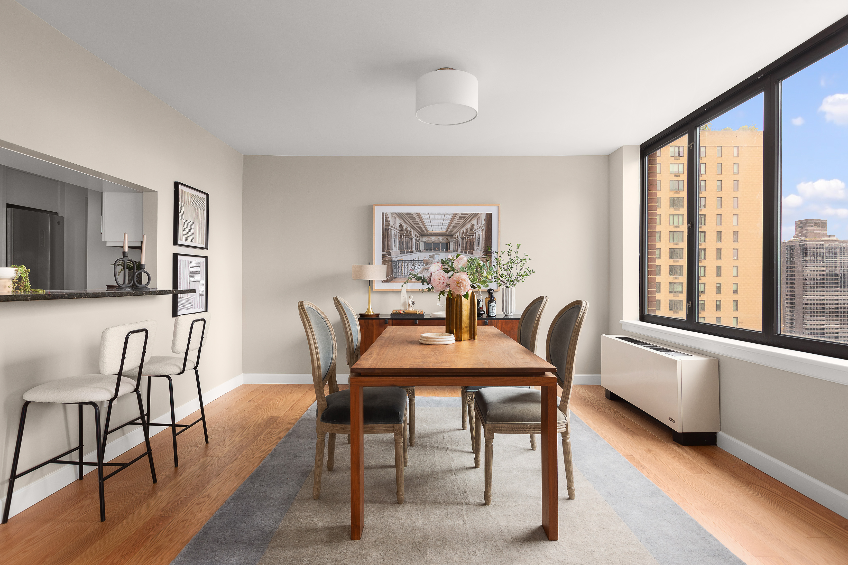 422 East 72nd Street, Unit 27C Manhattan, NY 10021 - Photo 10 of 25 a dining room with furniture and window