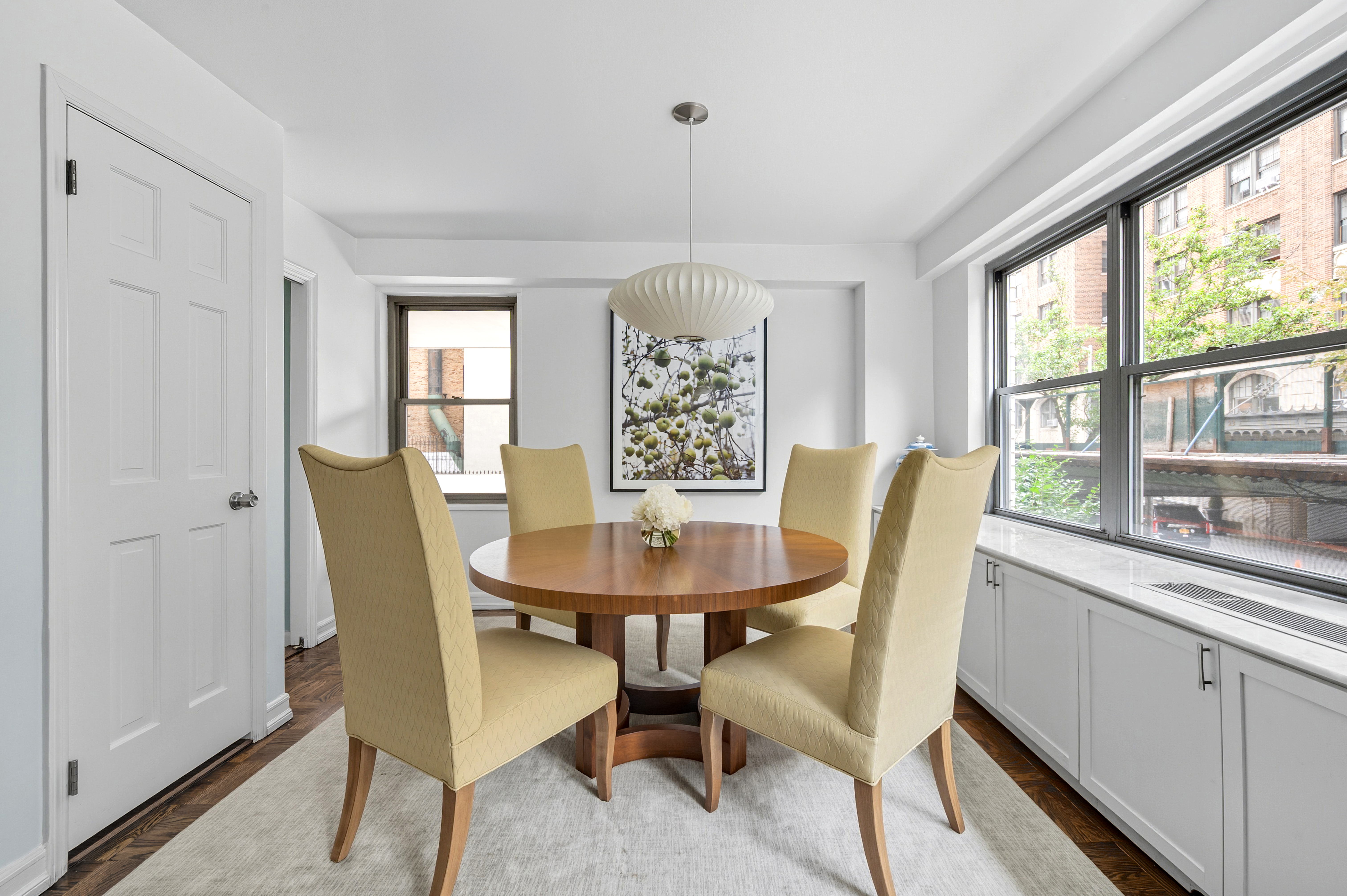 15 West 72nd Street, Unit 2C Manhattan, NY 10023 - Photo 3 of 9 a view of a dining room with furniture window and outside view