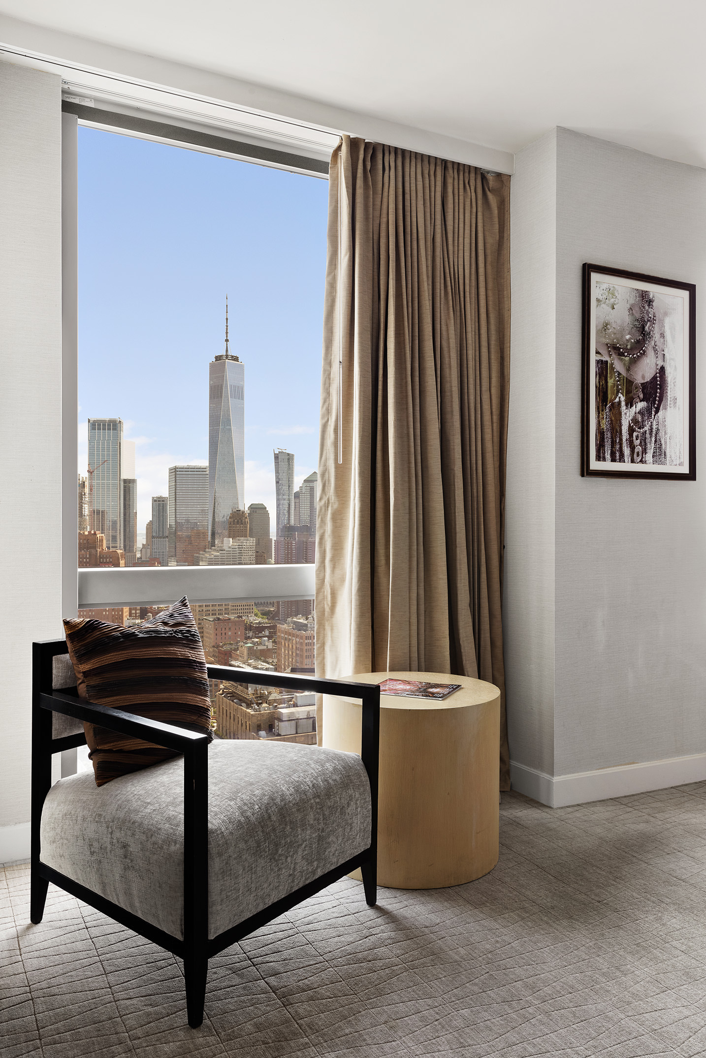 246 Spring Street, Unit 4104 Manhattan, NY 10013 - Photo 4 of 8 a view of kitchen with furniture and a window