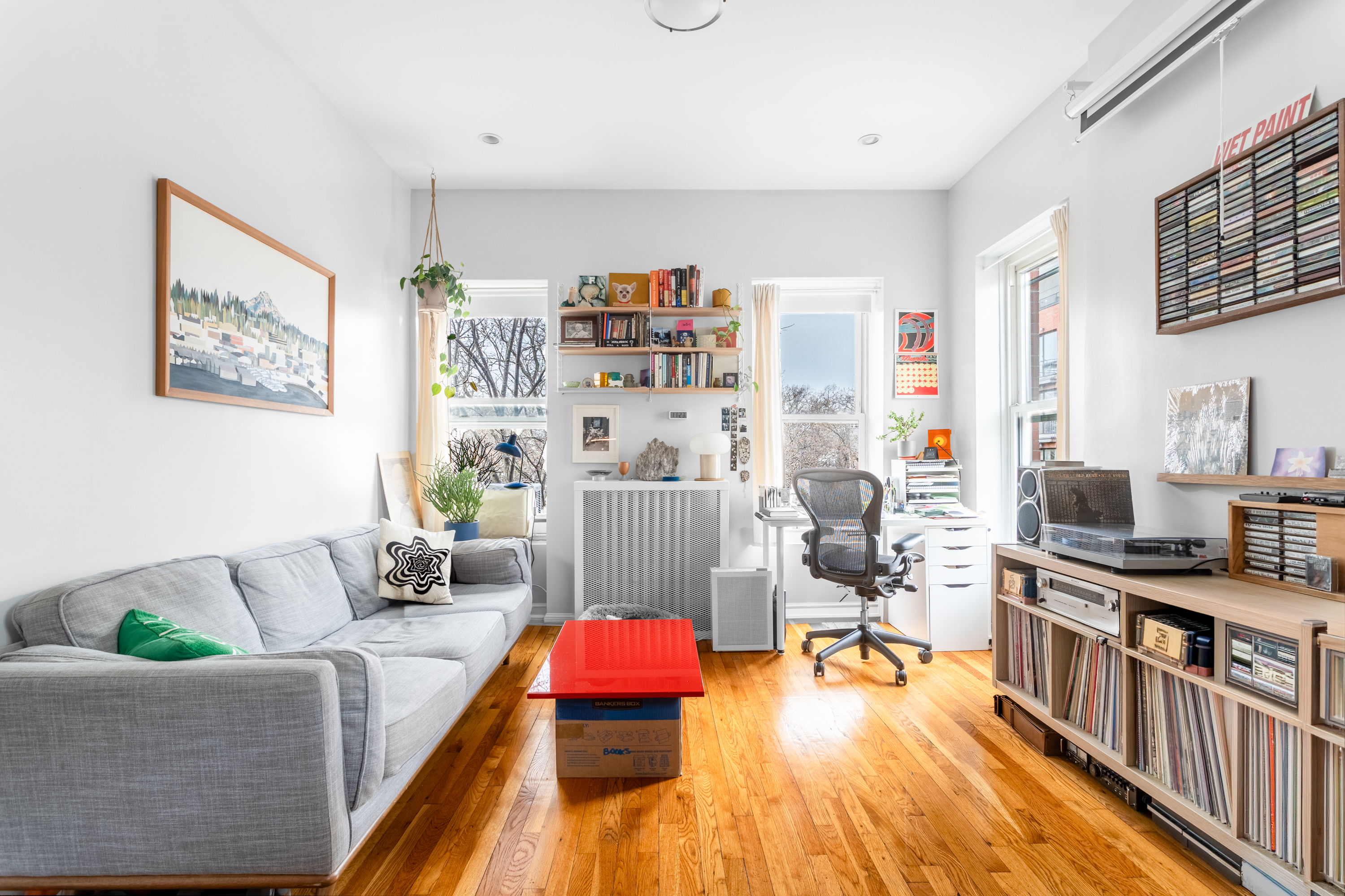 258 Halsey Street, Unit 3 Brooklyn, NY 11216 - Photo 2 of 10 a living room with furniture and a wooden floor