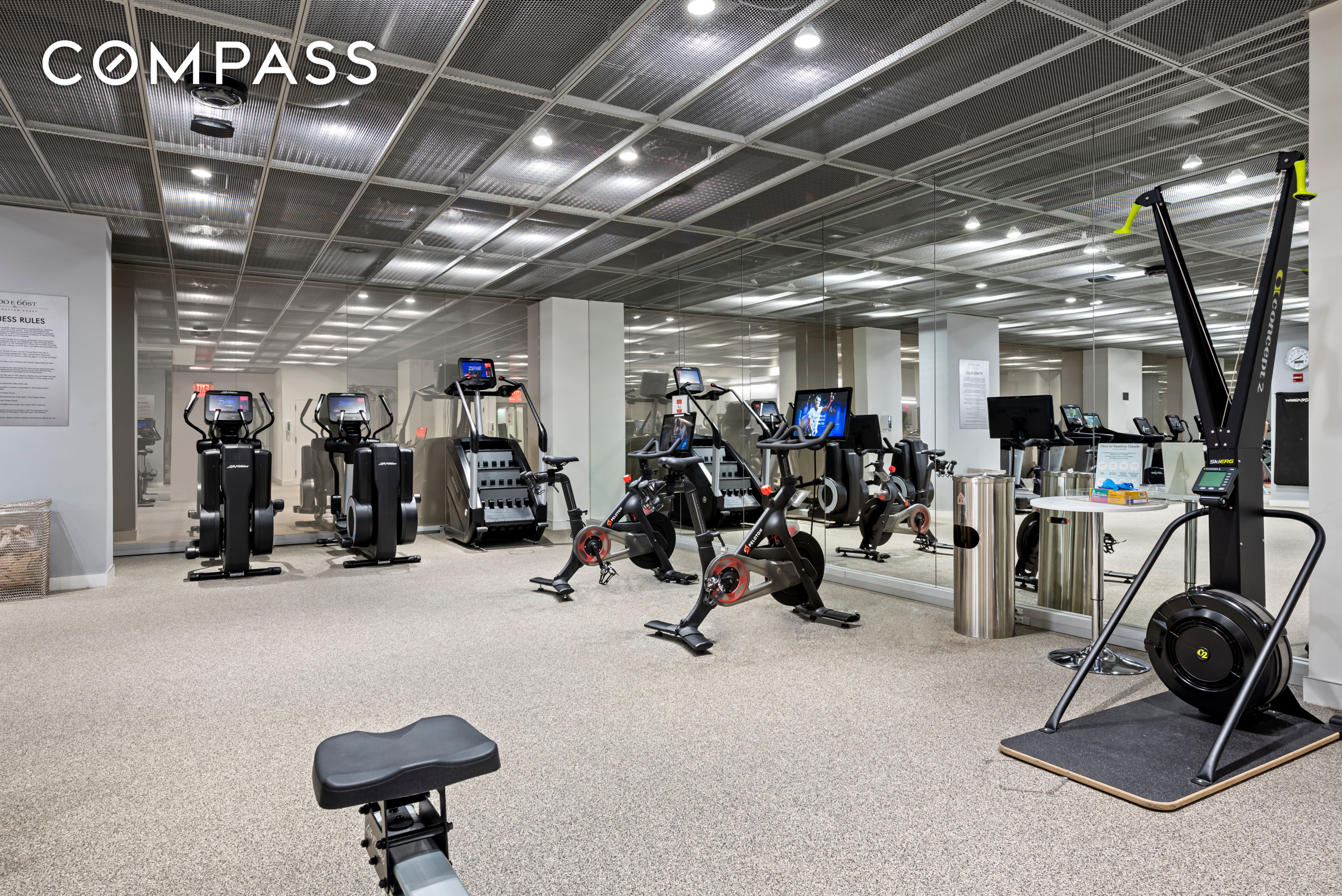 200 East 66th Street, Unit D1205 Manhattan, NY 10065 - Photo 24 of 33 a view of a room with gym equipment