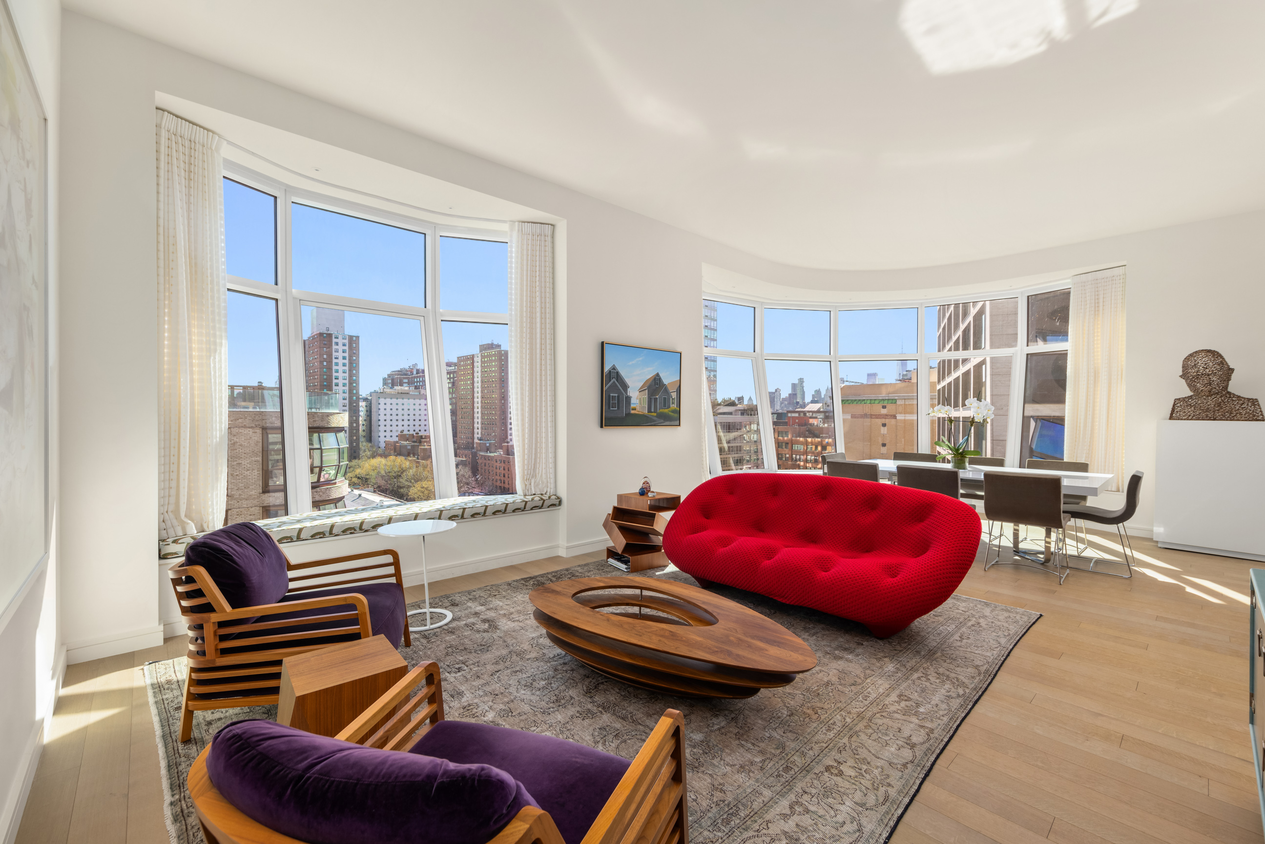515 West 18th Street, Unit 1102 Manhattan, NY 10011 - Photo 2 of 18 a bedroom with furniture and a large window
