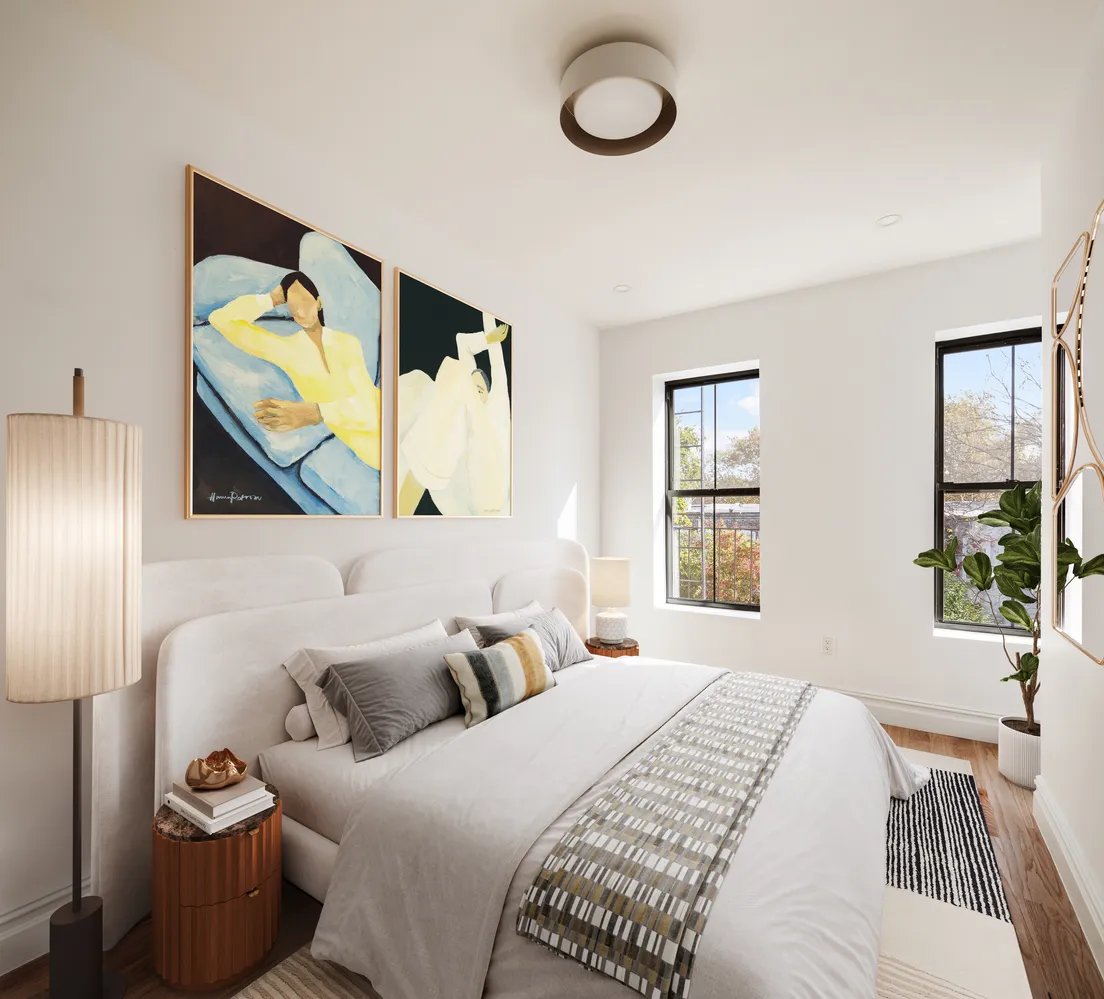 a bedroom with a bed and window