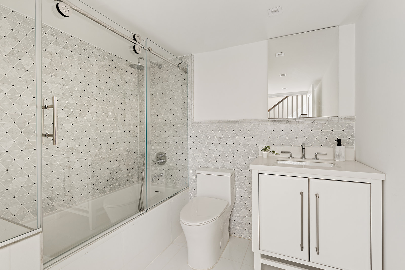 281 Jefferson Avenue Brooklyn, NY 11216 - Photo 13 of 25 a bathroom with a granite countertop sink a toilet and shower