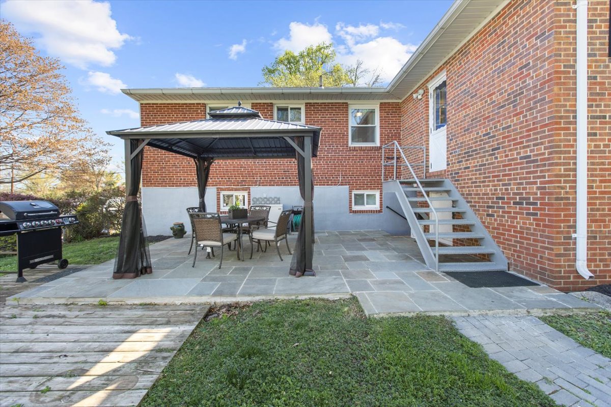 12712 Atherton Drive Silver Spring, MD 20906 - Photo 33 of 40 a view of a chairs and fire pit in the backyard