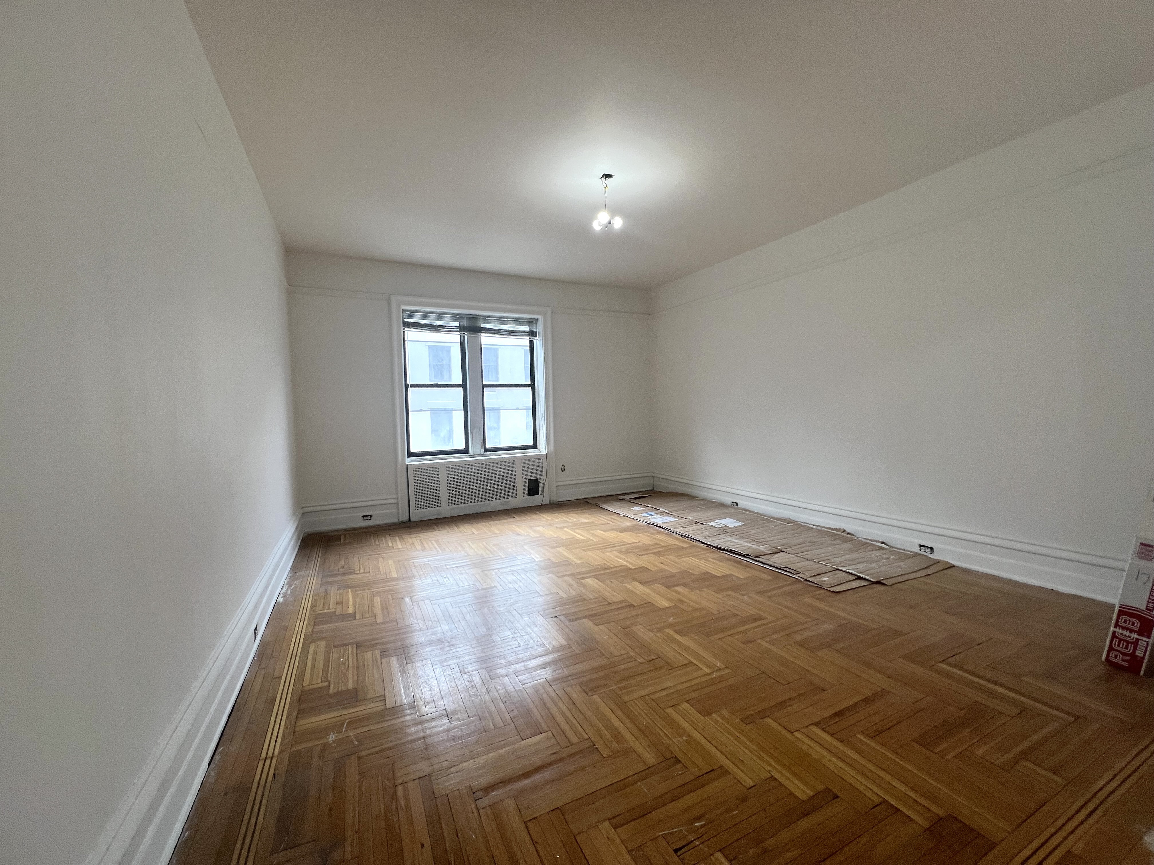 59 Livingston Street, Unit 3A Brooklyn, NY 11201 - Photo 2 of 19 an empty room with a fireplace and windows