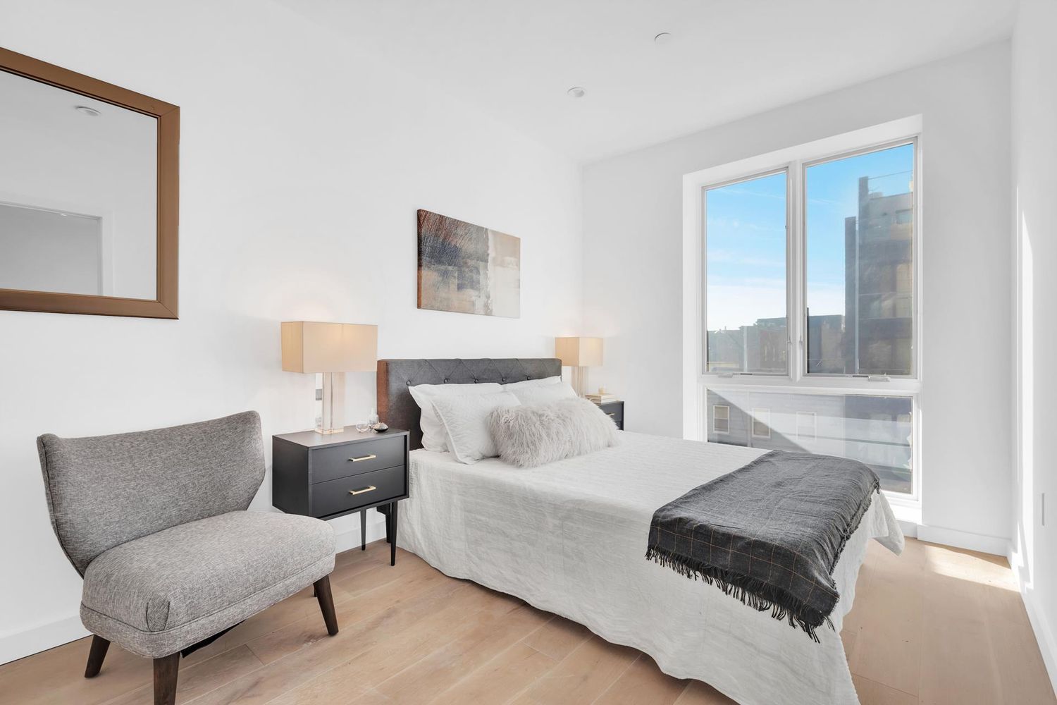 250 Manhattan Avenue, Unit 3F Brooklyn, NY 11211 - Photo 4 of 7 a living room with furniture and a large window