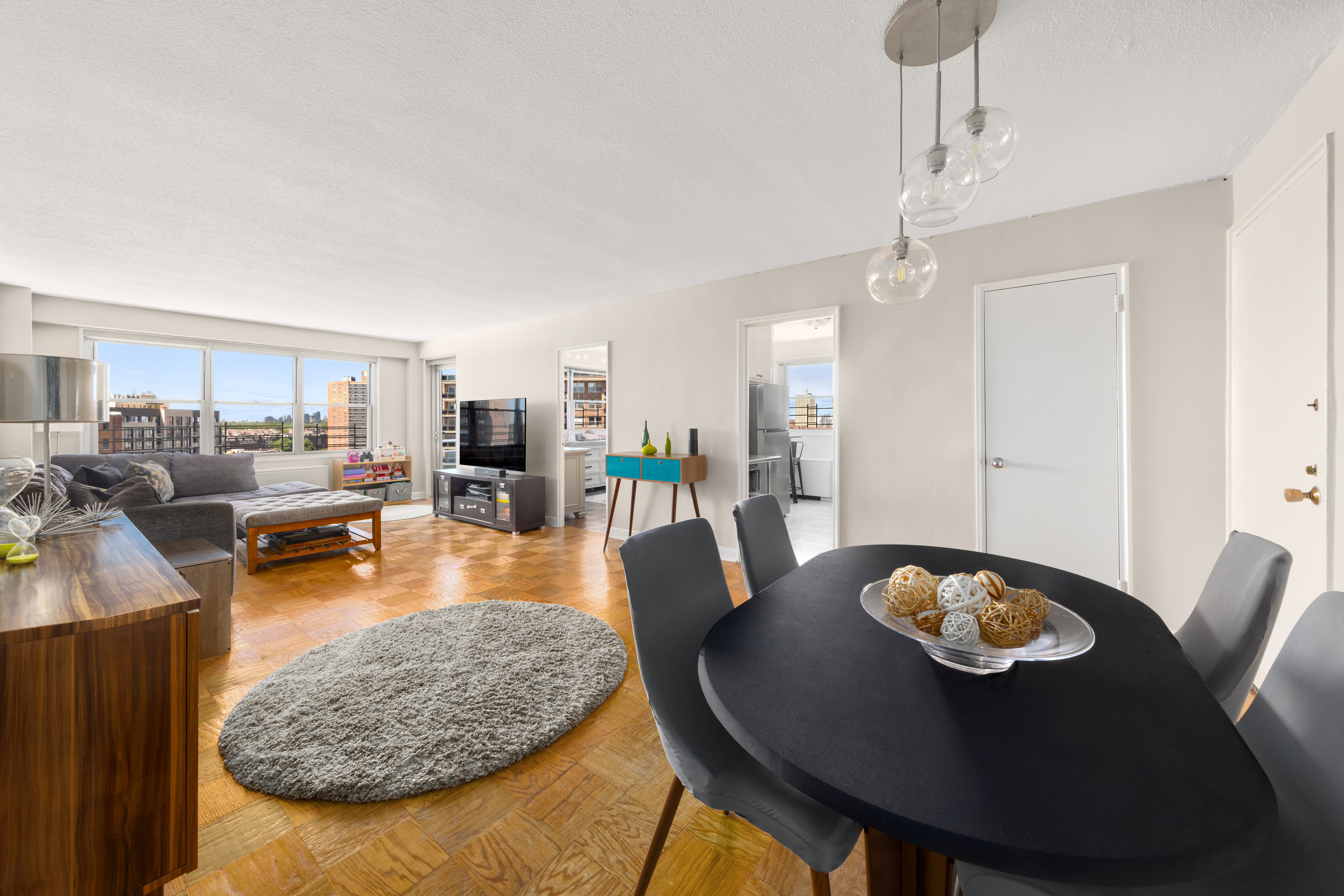 70-31 108th Street, Unit 12D Queens, NY 11375 - Photo 2 of 16 a view of a dining room with furniture and wooden floor
