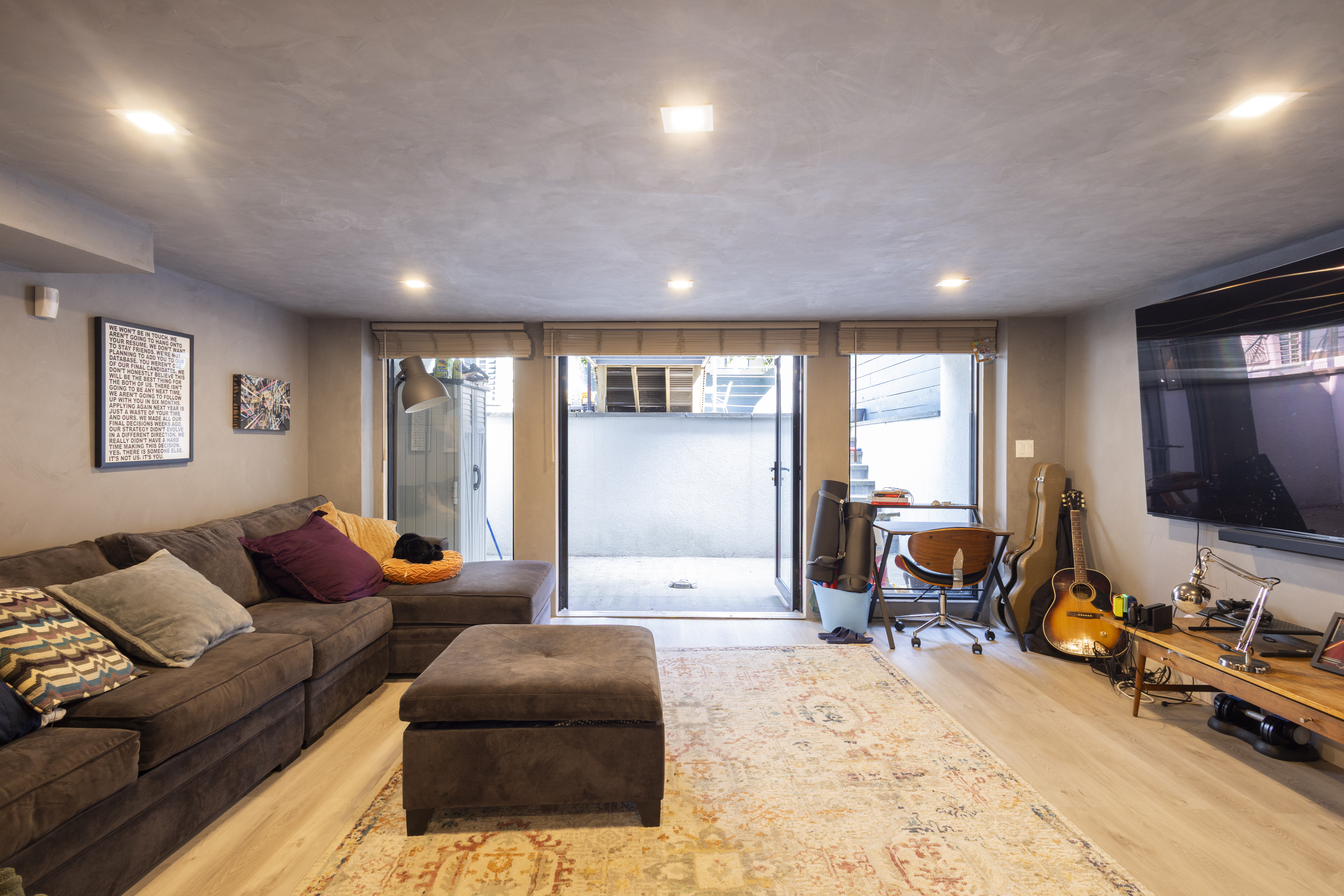 239 Winthrop Street Brooklyn, NY 11225 - Photo 11 of 20 a living room with furniture and a flat screen tv