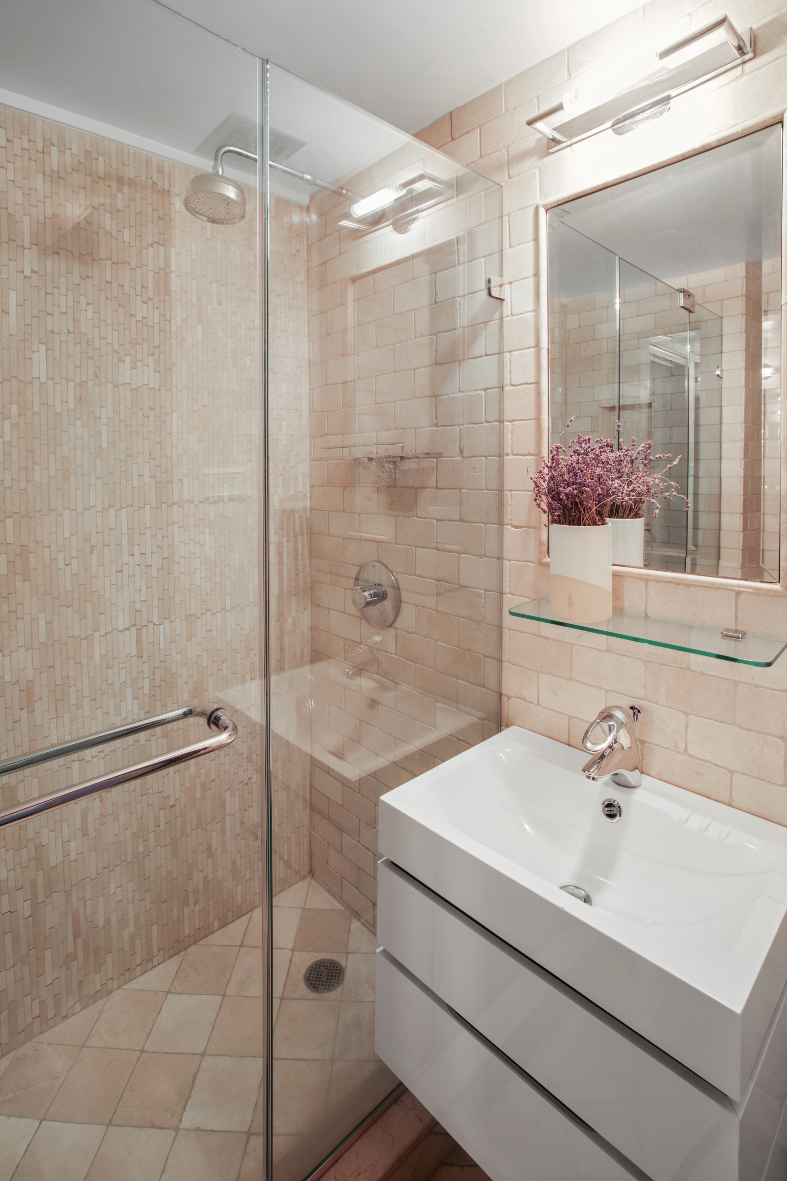 200 West 20th Street, Unit 1409/10 Manhattan, NY 10011 - Photo 13 of 15 a bathroom with a sink shower and a mirror
