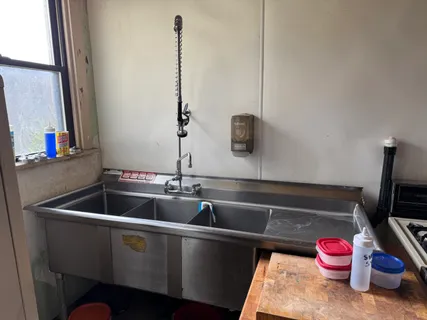 a kitchen with a sink and cabinets