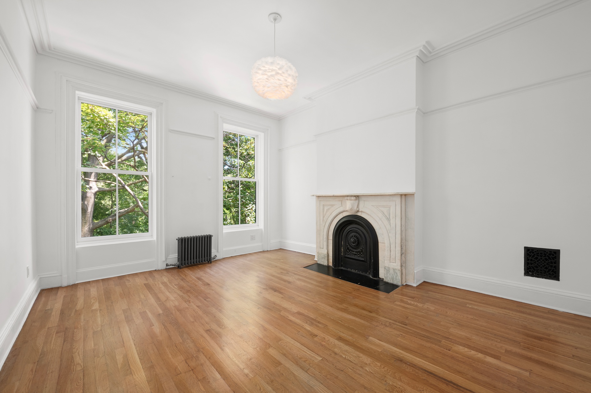 73 St James Place, Unit 2 Brooklyn, NY 11238 - Photo 7 of 15 a view of a livingroom with a fireplace and window