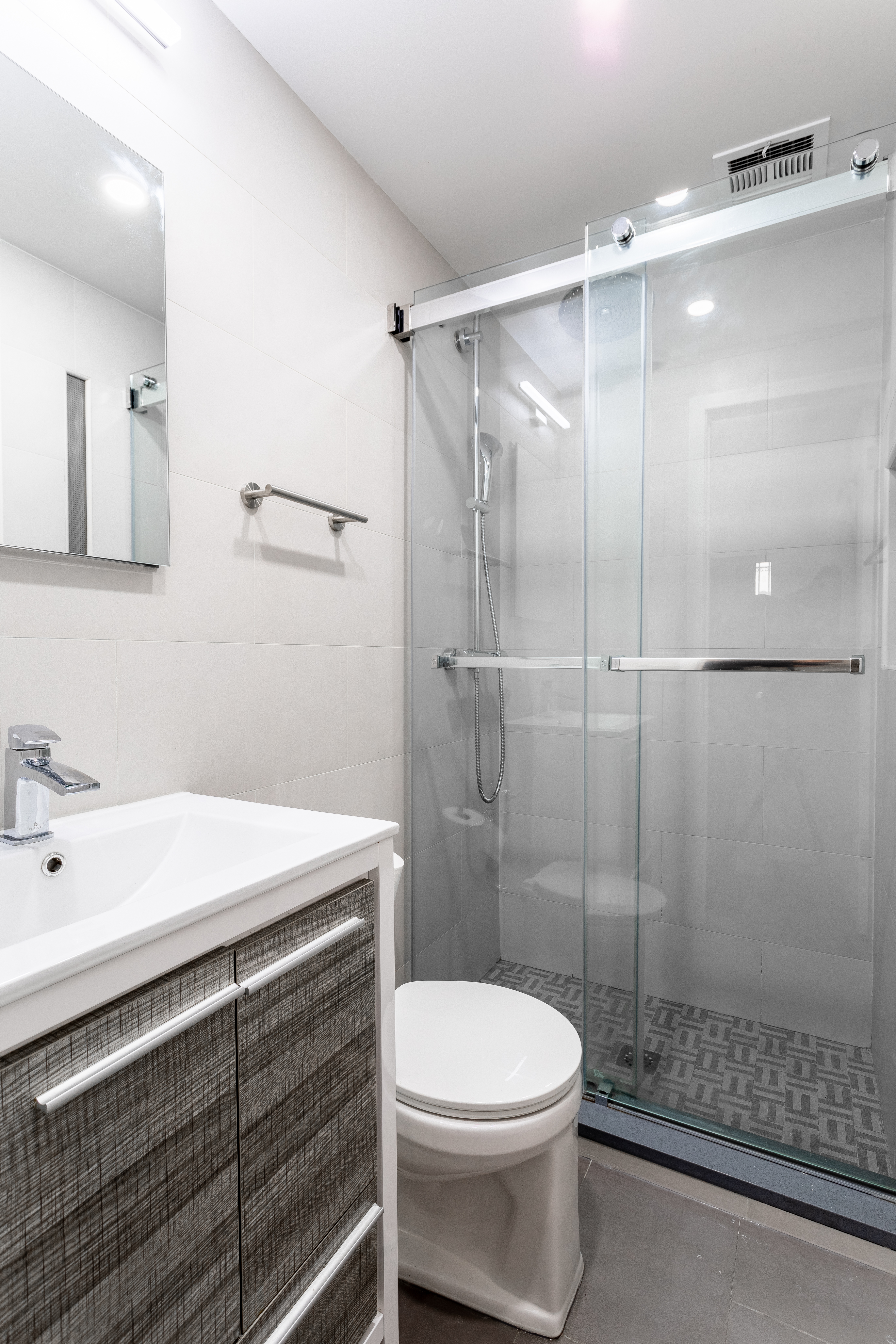 130 West 71st Street, Unit 1 Manhattan, NY 10023 - Photo 9 of 10 a bathroom with a sink a toilet and shower