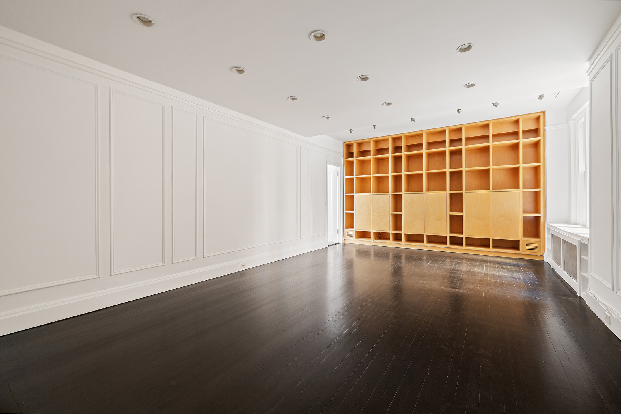 310 West End Avenue, Unit 2A Manhattan, NY 10023 - Photo 8 of 19 a view of an empty room with wooden floor and a window