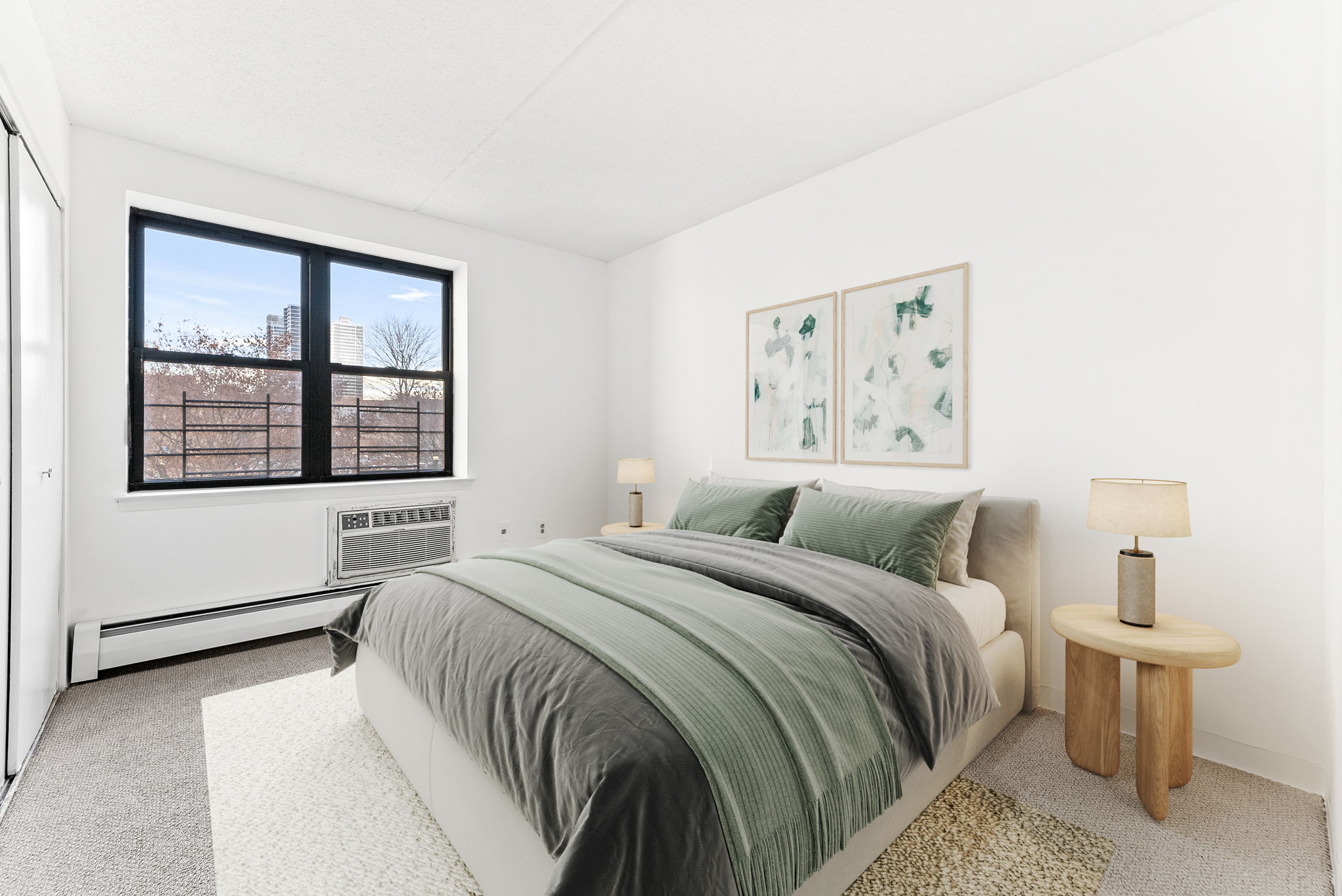 1919 Madison Avenue, Unit 214 Manhattan, NY 10035 - Photo 6 of 19 a bedroom with a large bed and a window