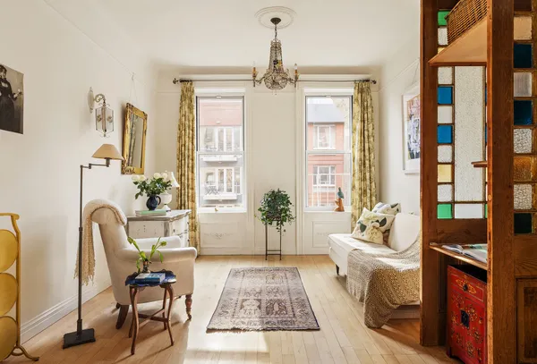 a living room with furniture rug and window