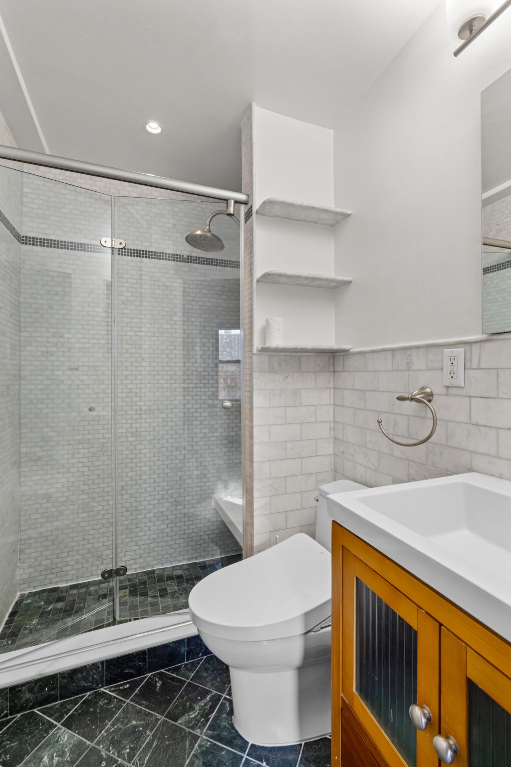 2 Tudor City Place, Unit 6JOS Manhattan, NY 10017 - Photo 12 of 16 a bathroom with a sink toilet and shower
