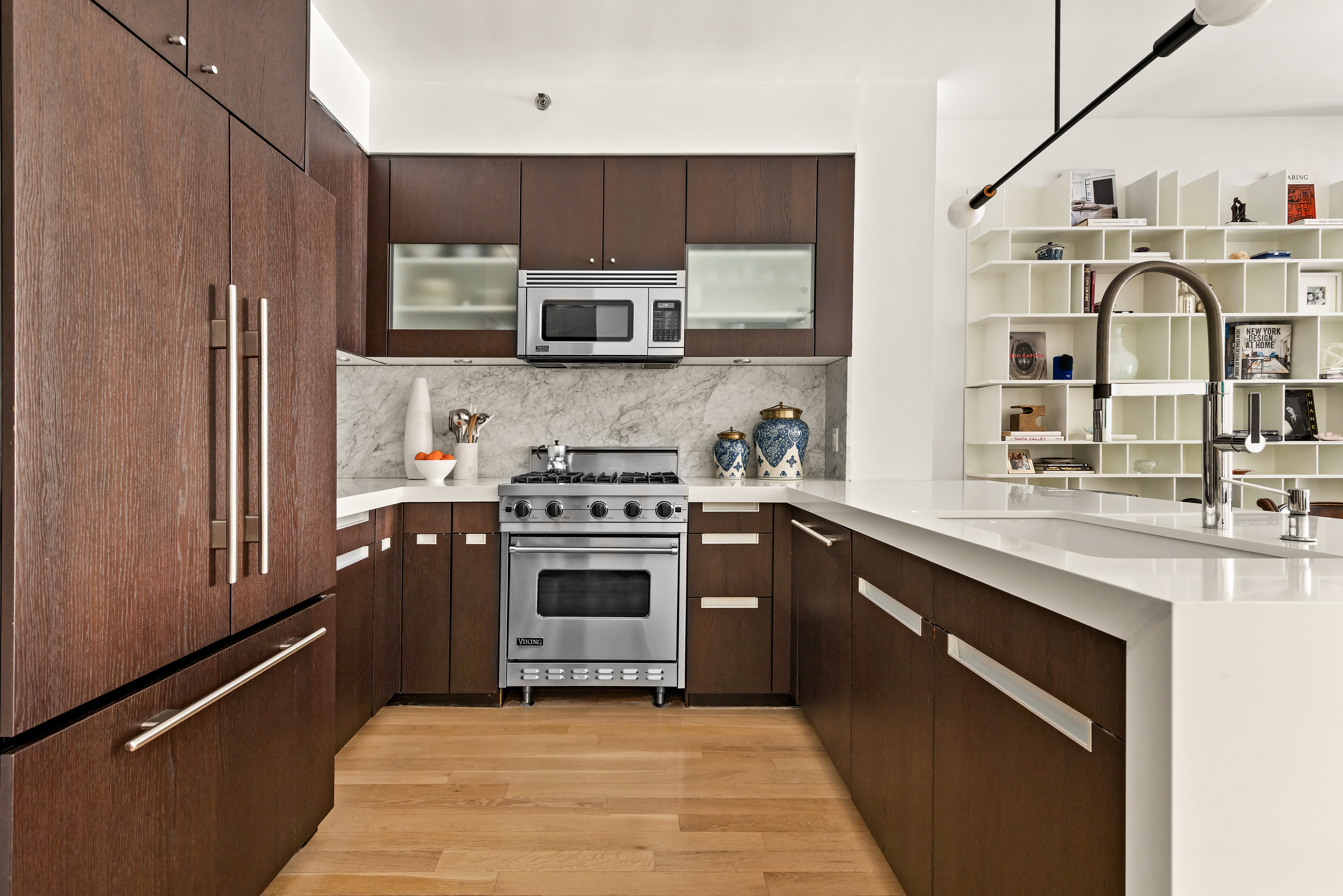 454 West 54th Street, Unit 5G Manhattan, NY 10019 - Photo 3 of 17 a kitchen with stainless steel appliances granite countertop a sink stove and refrigerator