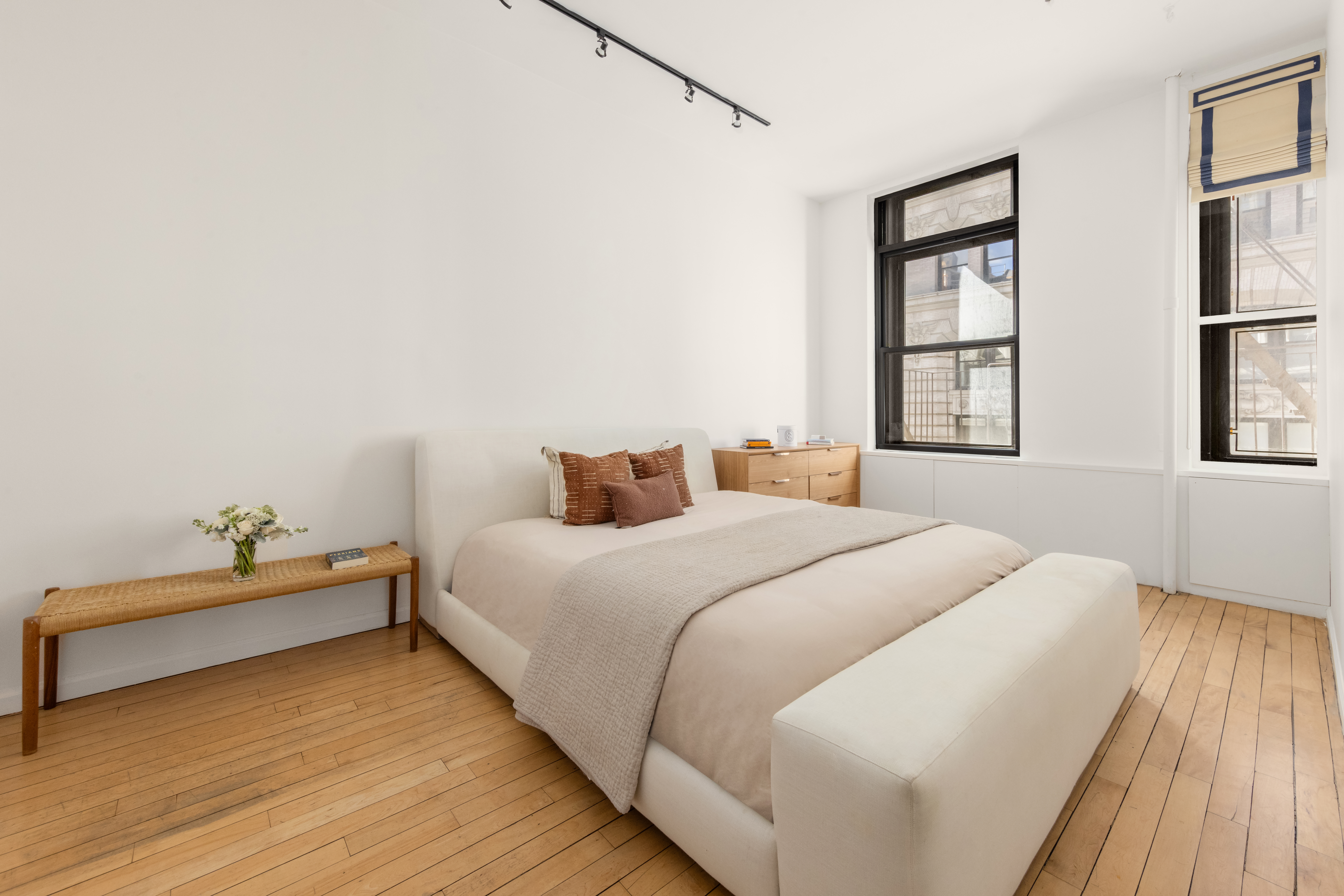 65 Leonard Street, Unit 4 Manhattan, NY 10013 - Photo 7 of 10 a bedroom with a bed and window