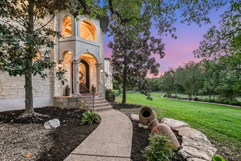 a front view of a house with garden