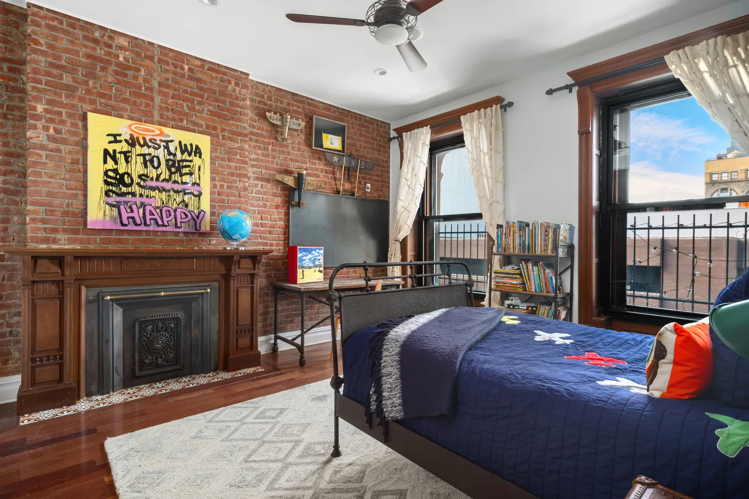 a bed sitting in a bedroom next to a window