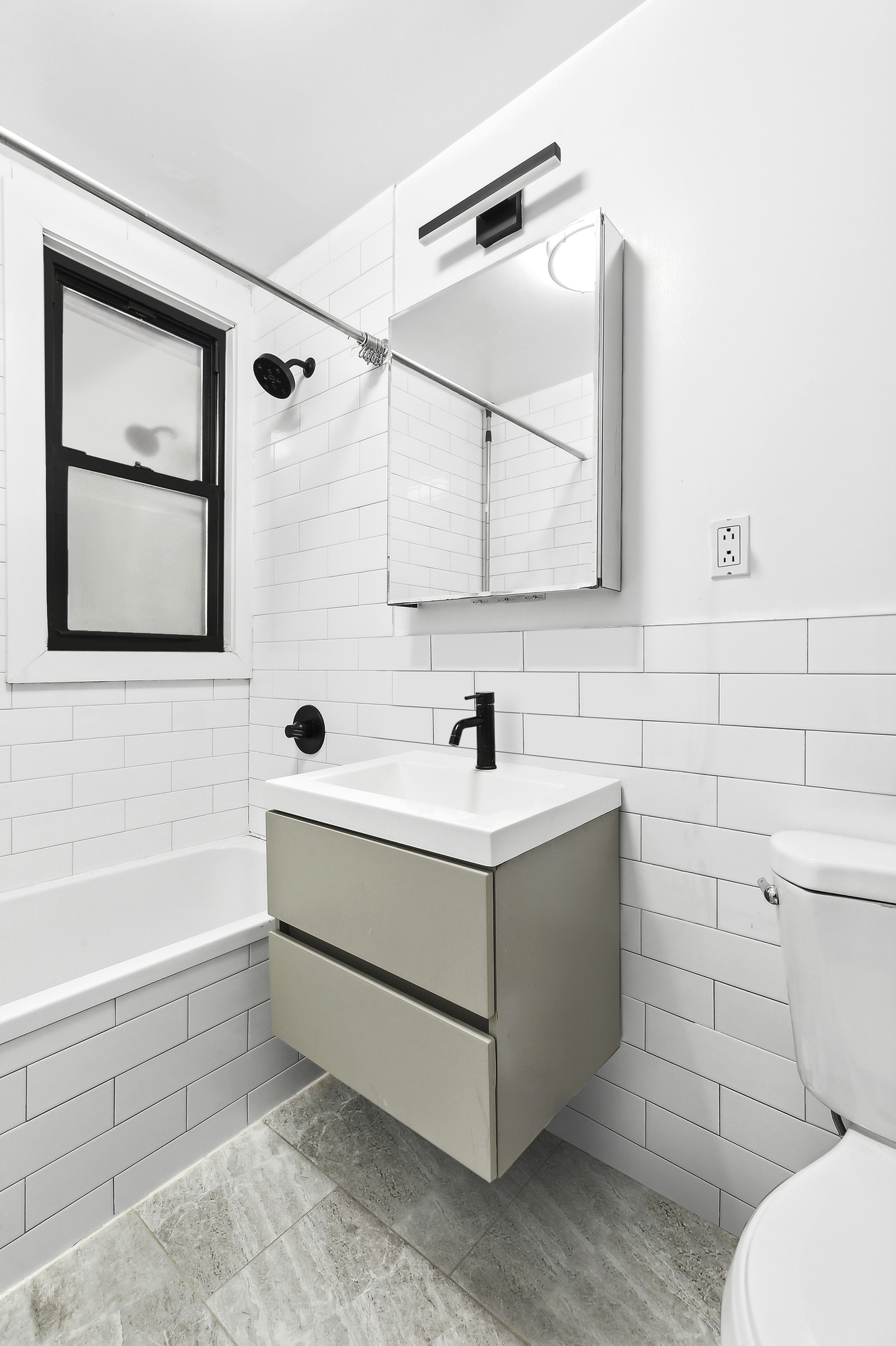 82 7th Avenue, Unit 4 Brooklyn, NY 11217 - Photo 7 of 10 a bathroom with a sink mirror vanity and toilet