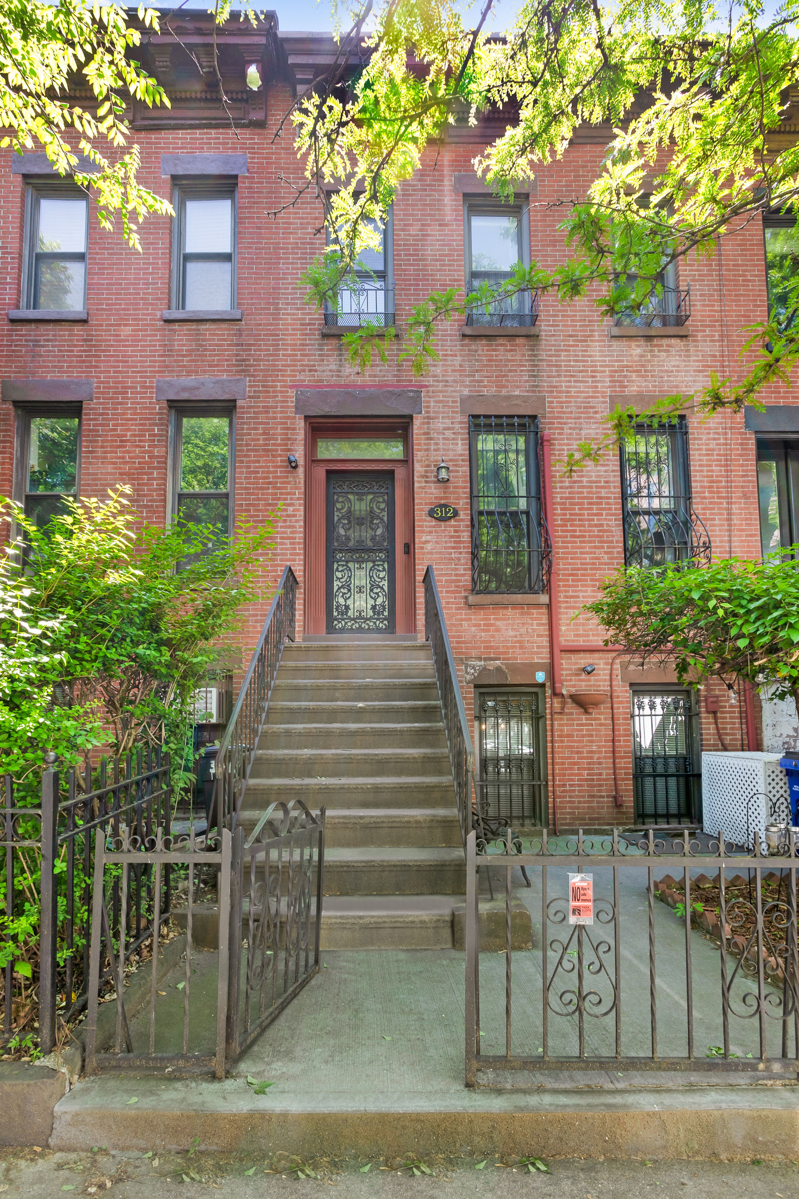 a view of a brick building with many windows