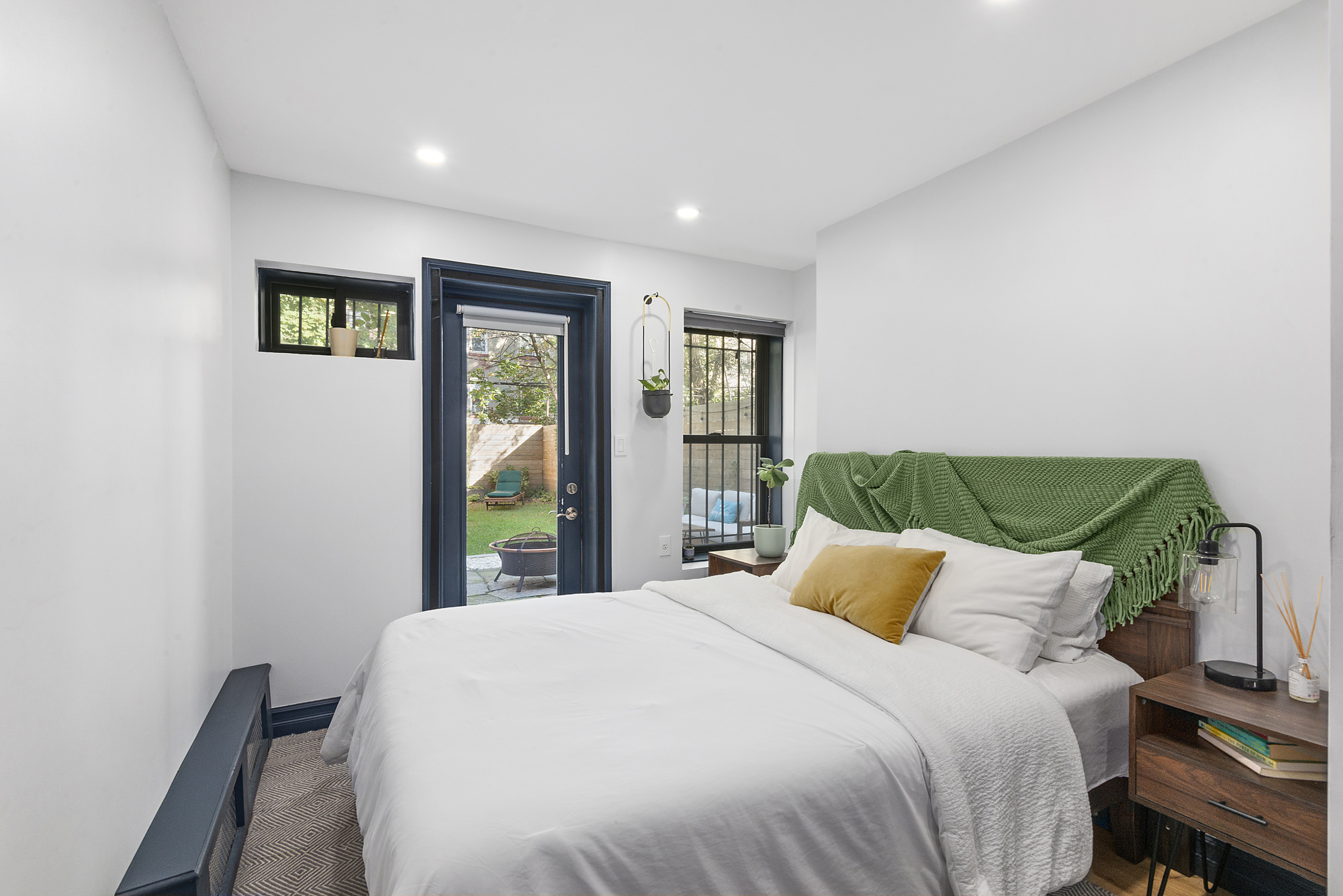 365 Bainbridge Street, Unit 1 Brooklyn, NY 11233 - Photo 5 of 8 a bedroom with a bed and a window